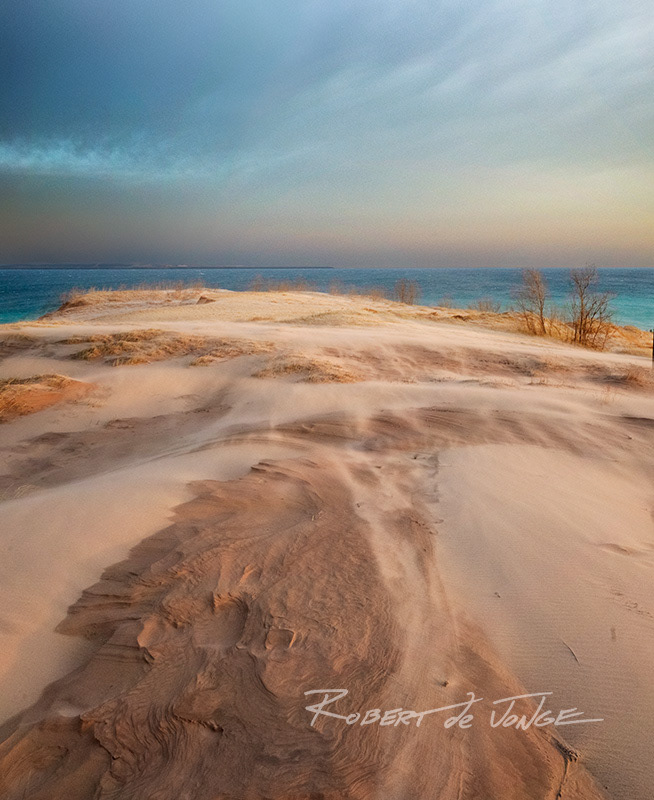 At Sleeping Bear Point a gale force wind leaves it's impressions in the crown of the dunes — early morning light