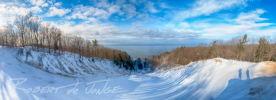 The top of a blowout dune at Hoffmaster StatePark on Lake Michigan. Morning shadows lay across the surface of the dune's saddle