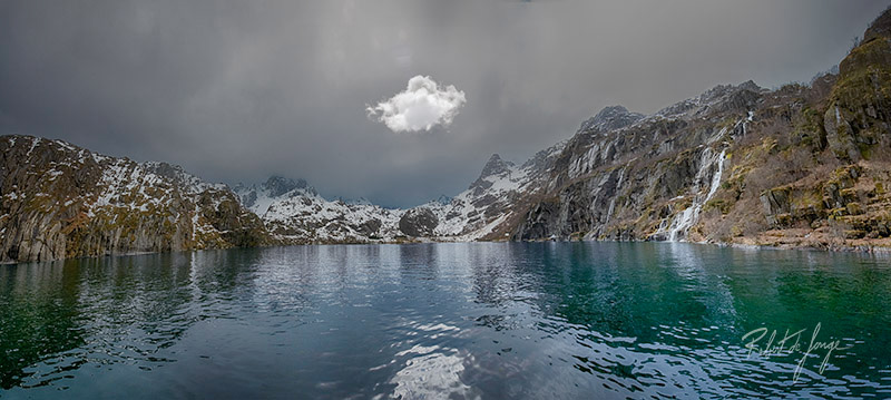 Crusing the Trollfjord and finding a bright cloud hovering over calm waters