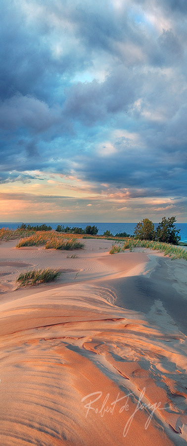 The sunset reveals a carved landscape on top of Sleeping Bear Point