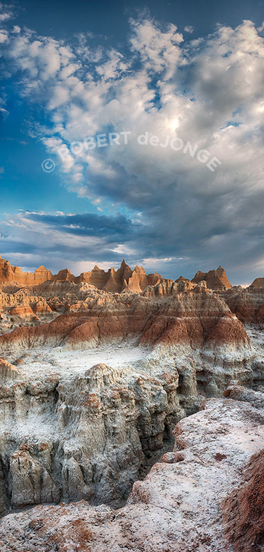 The Badlands, morning, sunrise, crevasse, colors. National Park, South Dakota, vertical, clay, powder