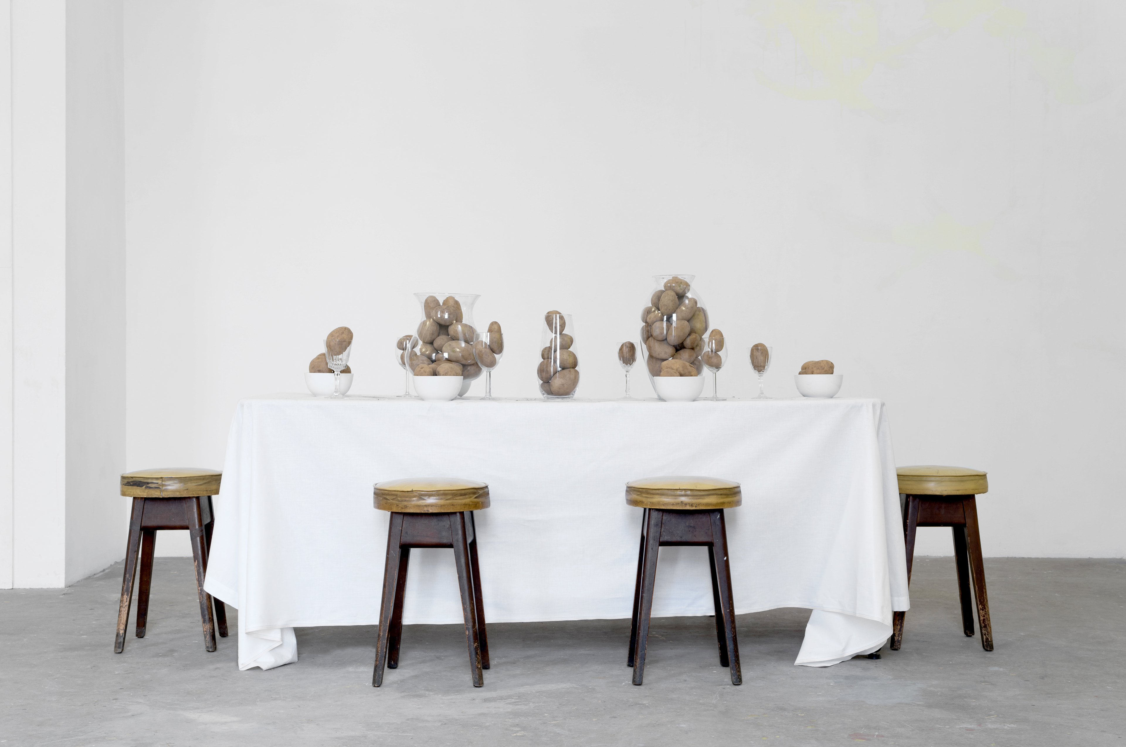 Another Exile; Christine Moldrickx by Jess Carnegie, Peter Holgate, Is van Leest, and Anna Stacey, 2016; potatoes and glass wear, table cloth, furniture; dimensions variable