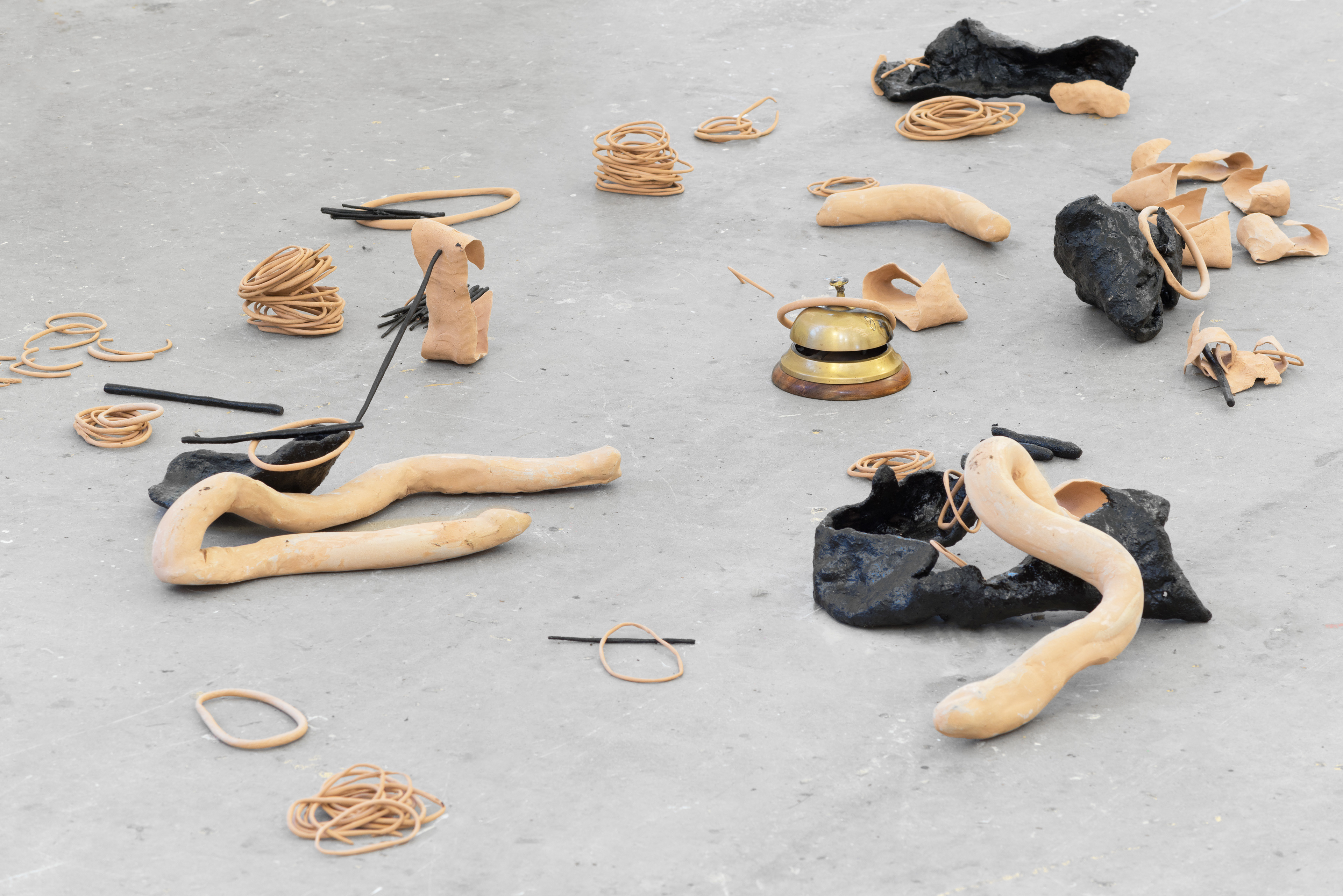 Taut (in eight parts); Rene McBrearty, 2017; clay, bitumen, performance