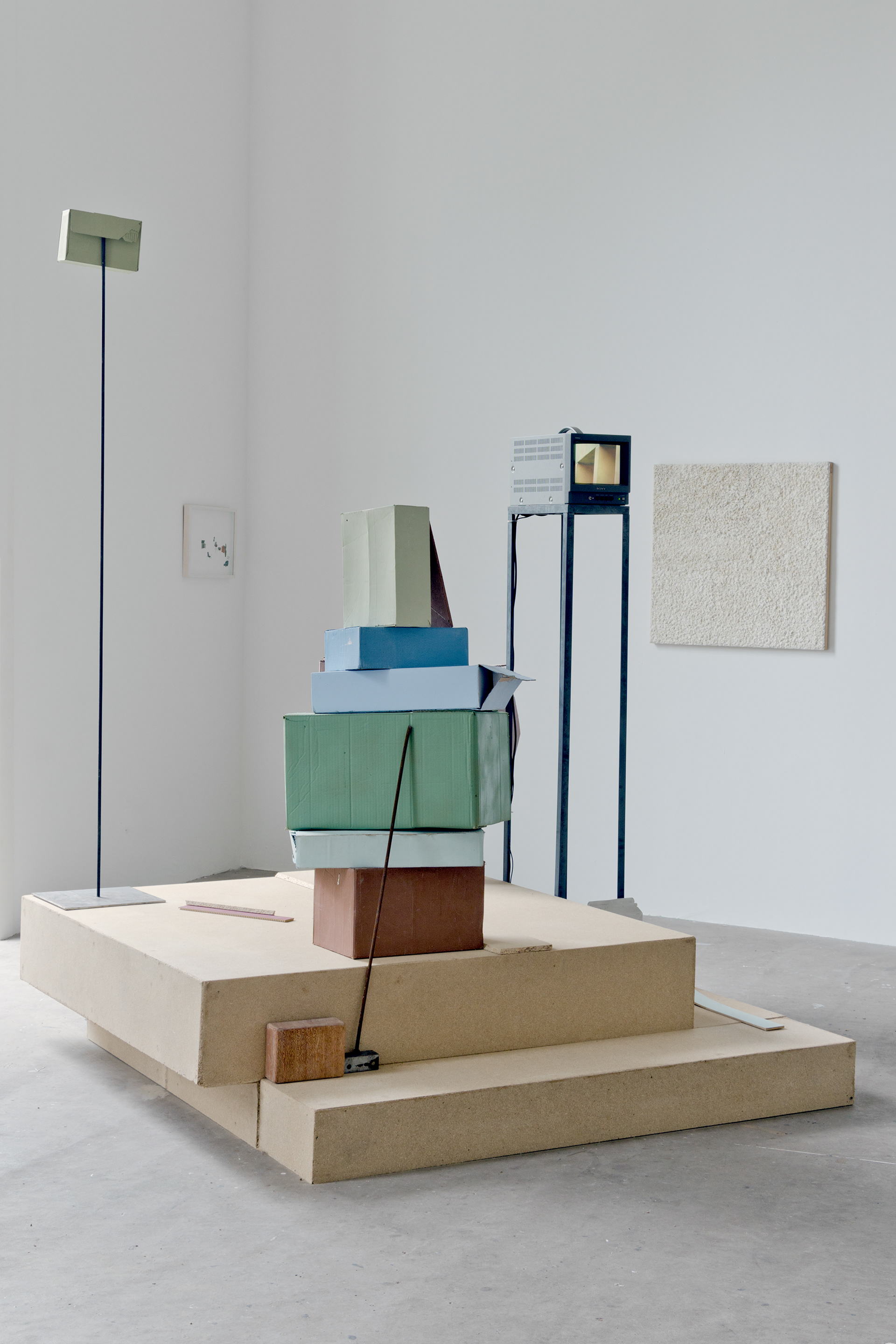 Every Cardboard Box Has A Dream; Rosie Sillitoe, 2013; Sculptural Installation incorporating: chipboard, cardboard, emulsion paint, mild steel TV monitor, Very Low Frequency Radio; 150 × 150cm approx.