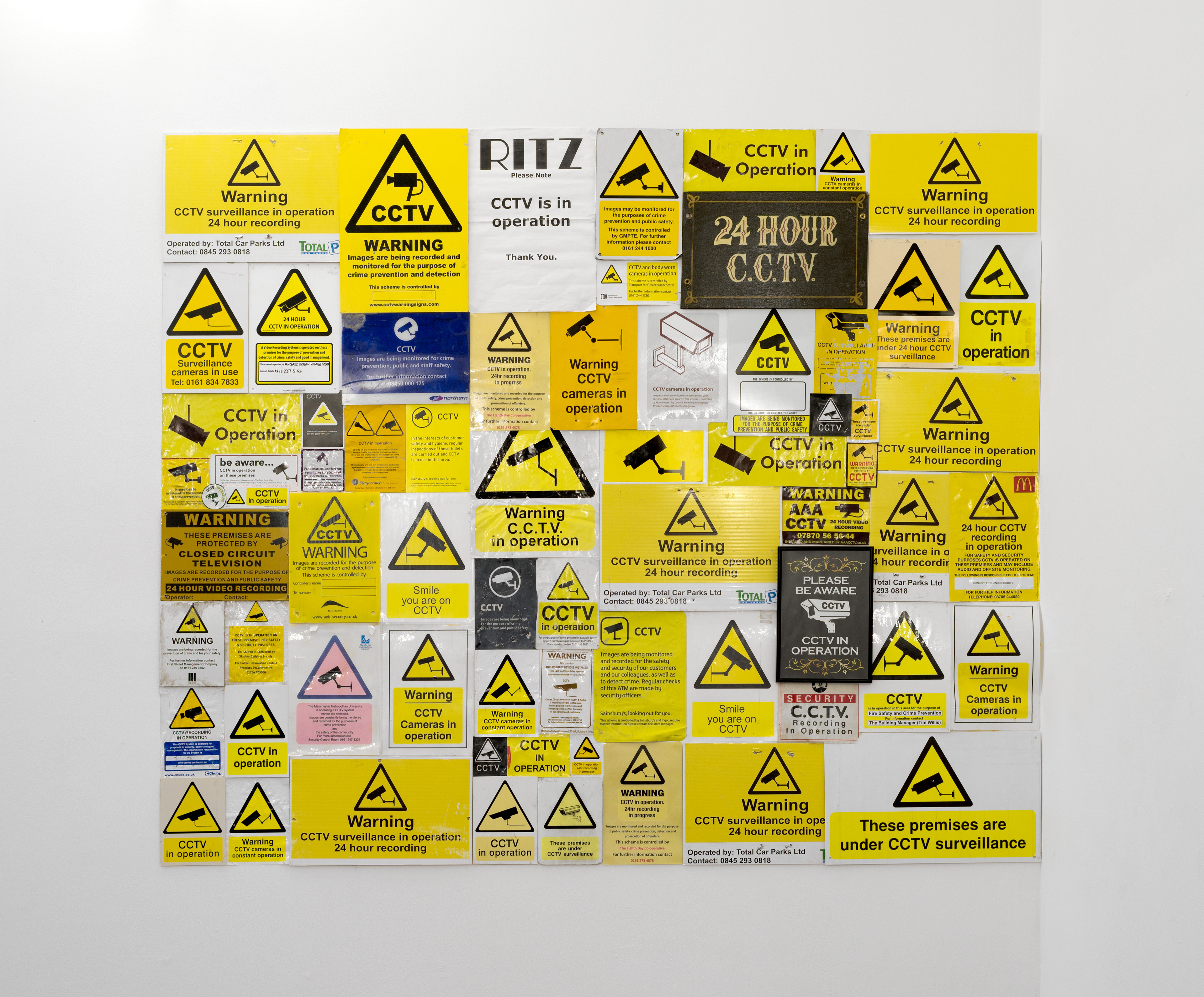 The Walls Have Ears; Annie Leader, 2015; CCTV signs; dimensions variable