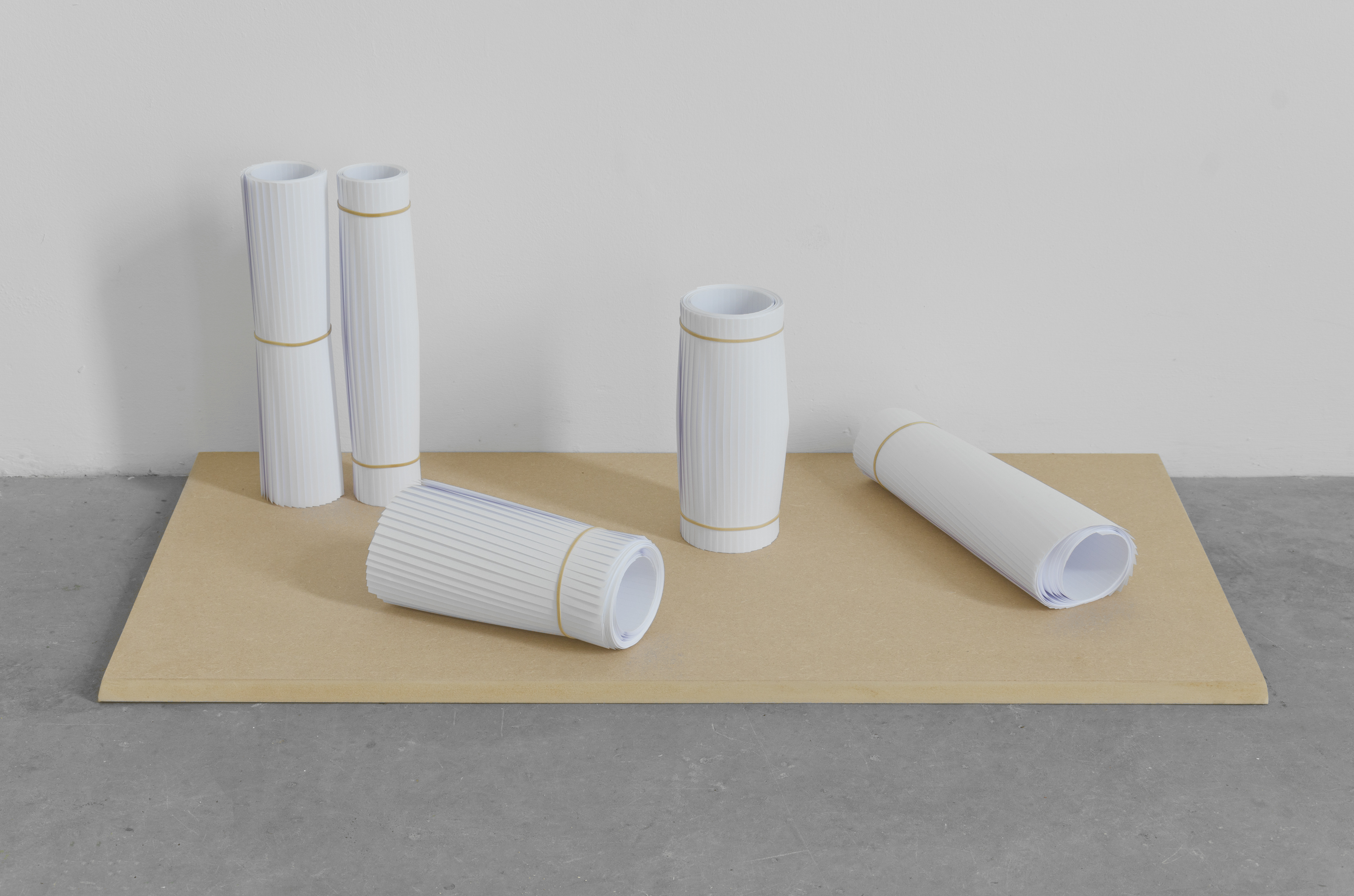 Rolls ; Ian Jackson, 2013; Rolled A4 paper with rubber bands; 45 × 90 × 21cm