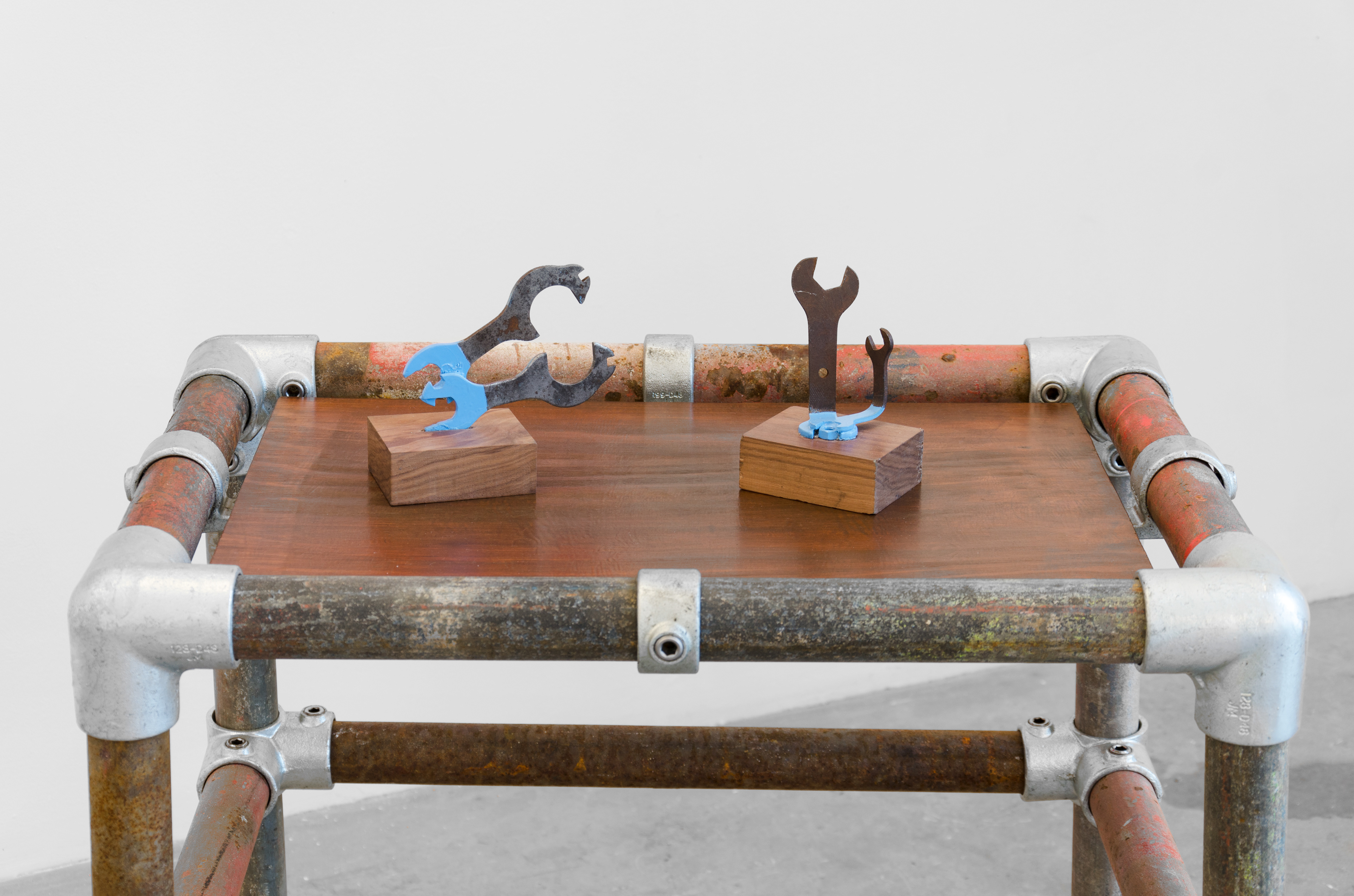 Tangent; Aphra O’Connor, 2014; scaffolding poles, plywood, spanners, walnut, veneer frames, hinges, colour prints, metal brackets, enamel; 213 × 213 × 183cm