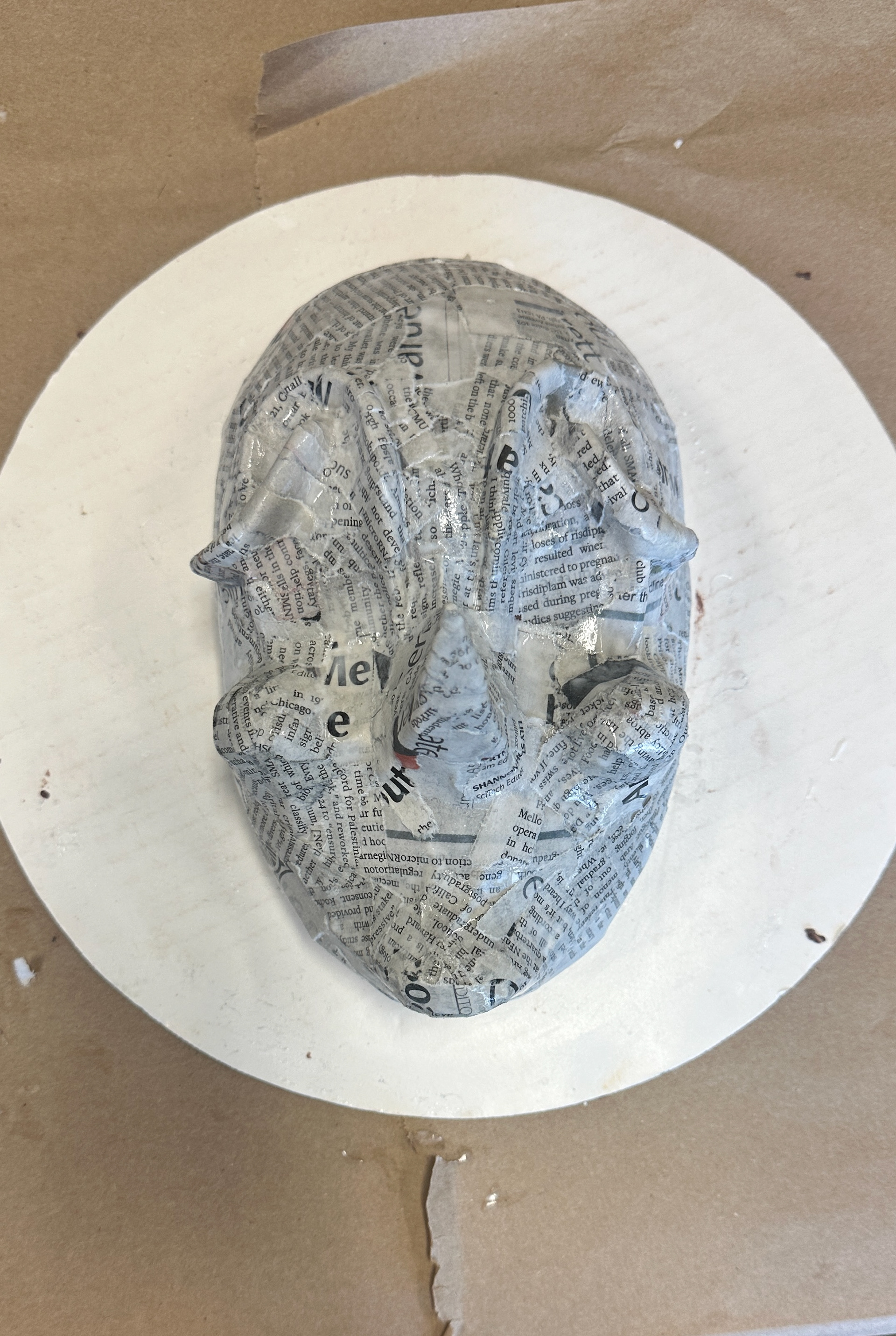 5 laters of paper mache, dried and sanded between each layer