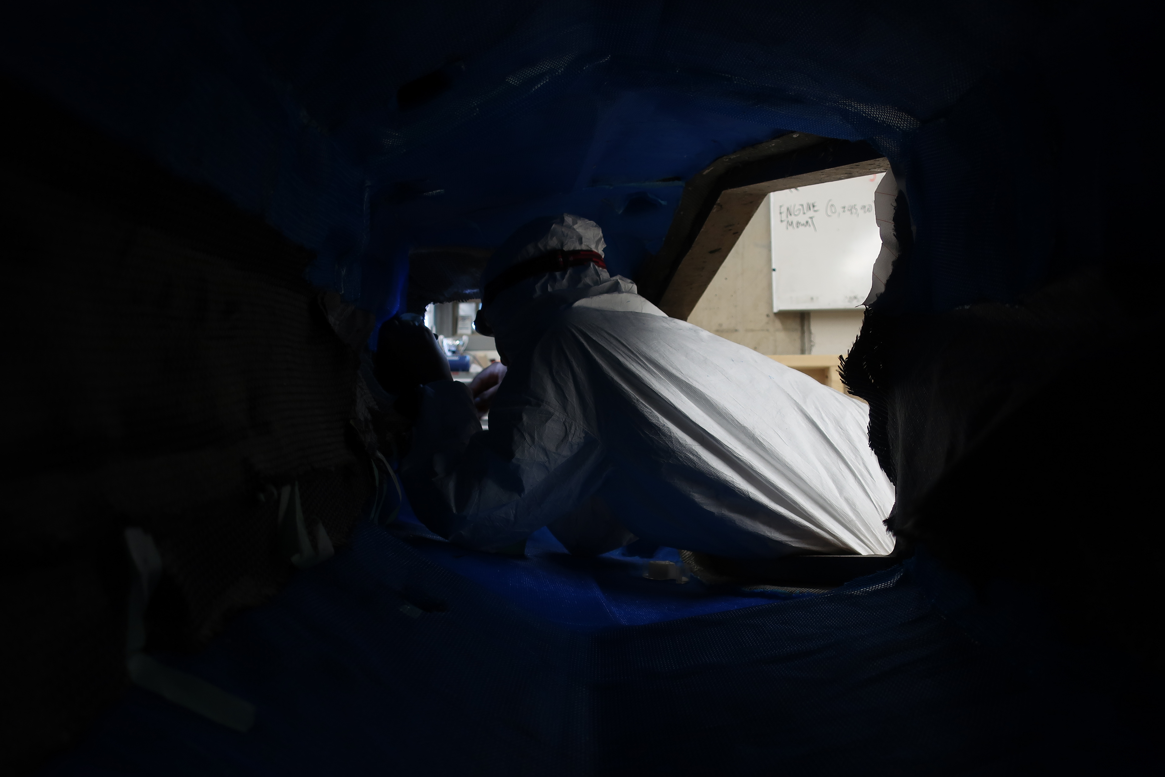 [Photo of me inside carbon-fiber monoque, Formula SAE 2018]