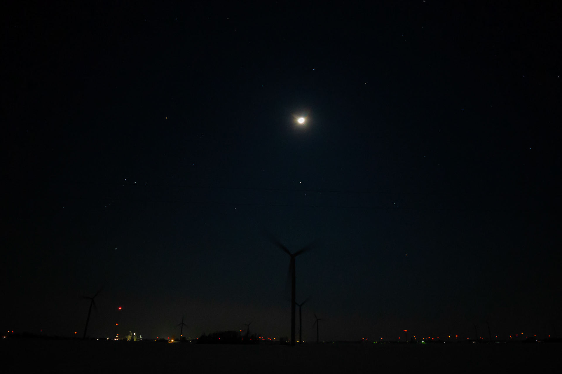 Moon over Turbine Farm at Night