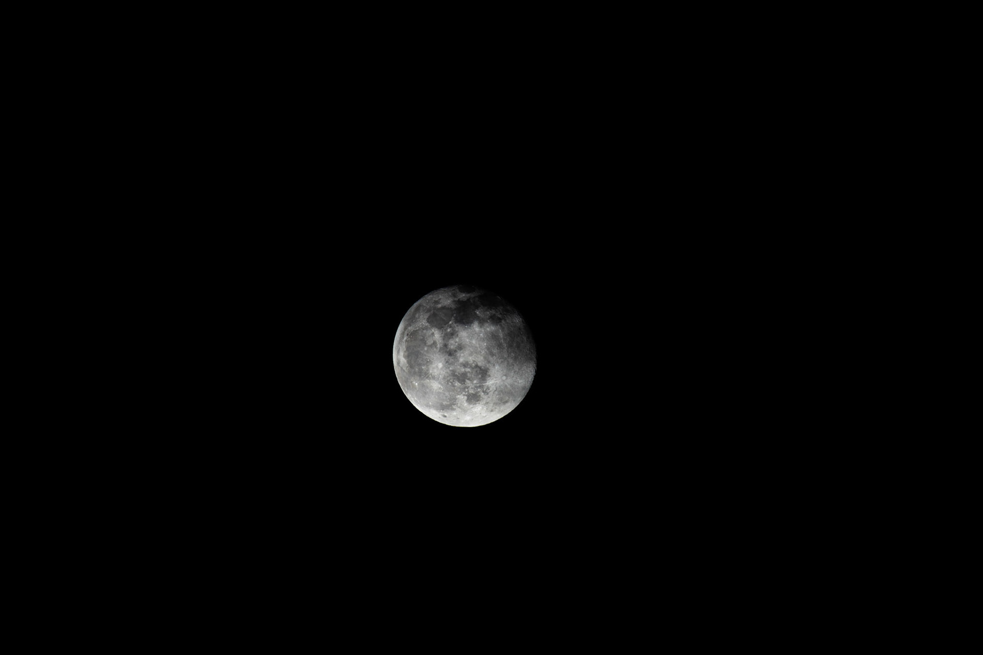 The moon from Pointe Aux Barques Lighthouse