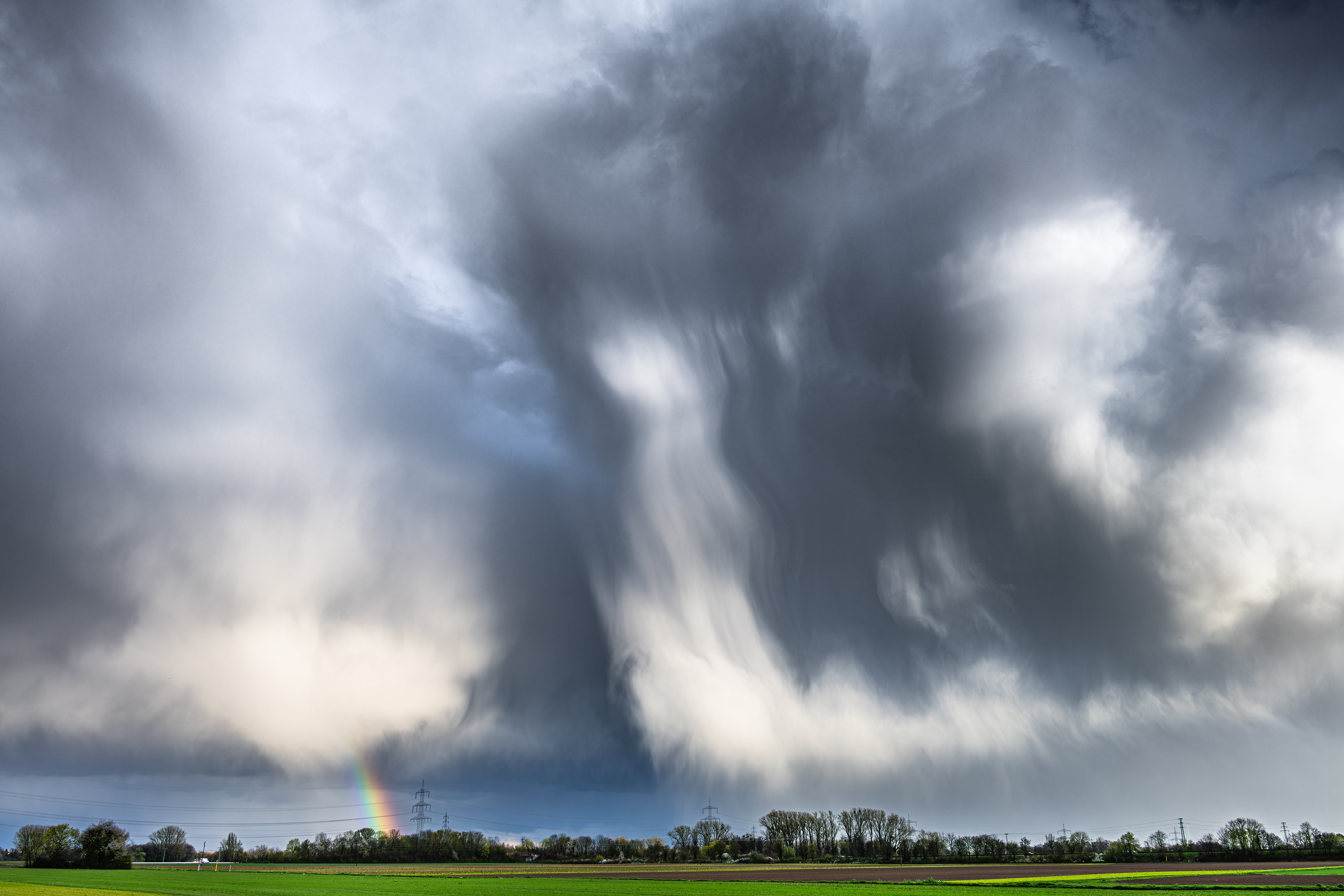 Regenbogen an abziehendem Cumulonimbus, Rheinzabern, RLP (D) - 23.03.2024