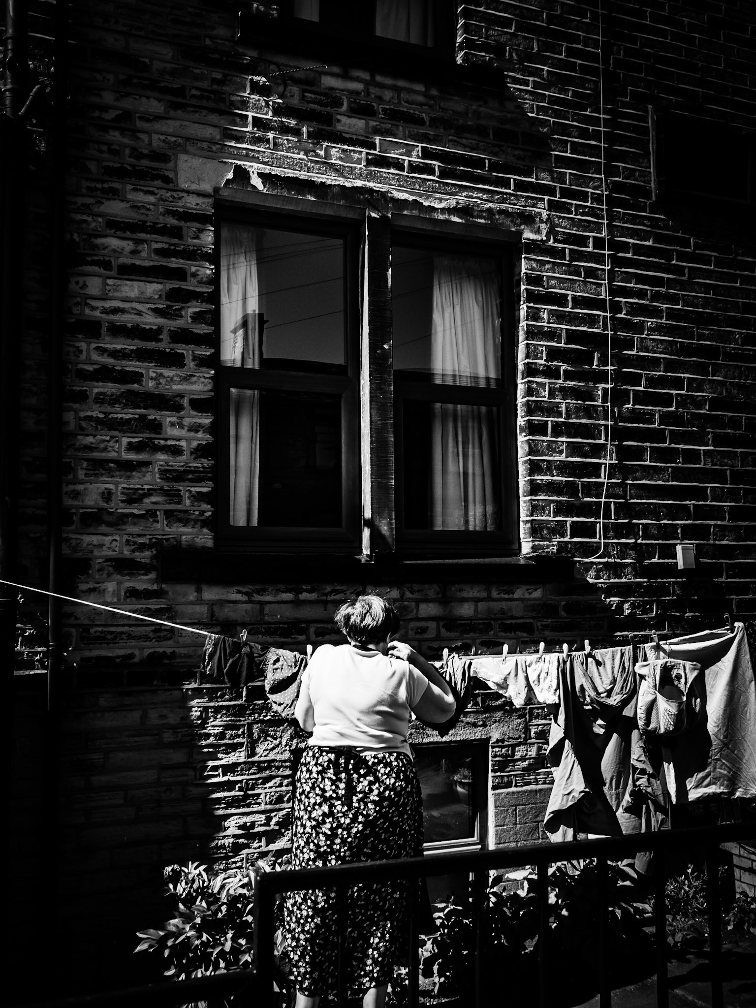 Woman hanging washing at Clifton