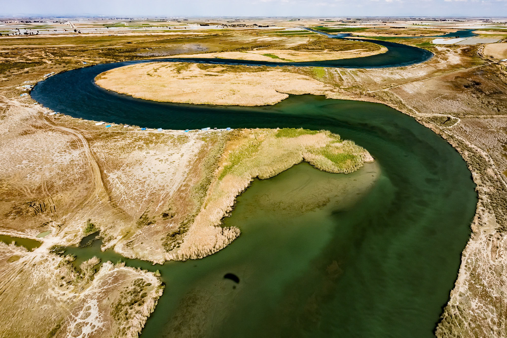 "Self-Portrait on Seyhan" - As I was flying towards the far side of the curve of the Seyhan River to shoot for the "Aerial Adana" series I shot this totally different scene with the sun behind me and my shadow on the river, hence my "self-portrait".