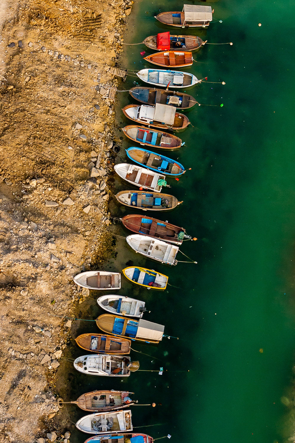 "Boats" - I shot the many small fishing boats moored side by side in the Marmara Sea straight down from my paramotor. The colors of the ground and the green water make a nice contrast.