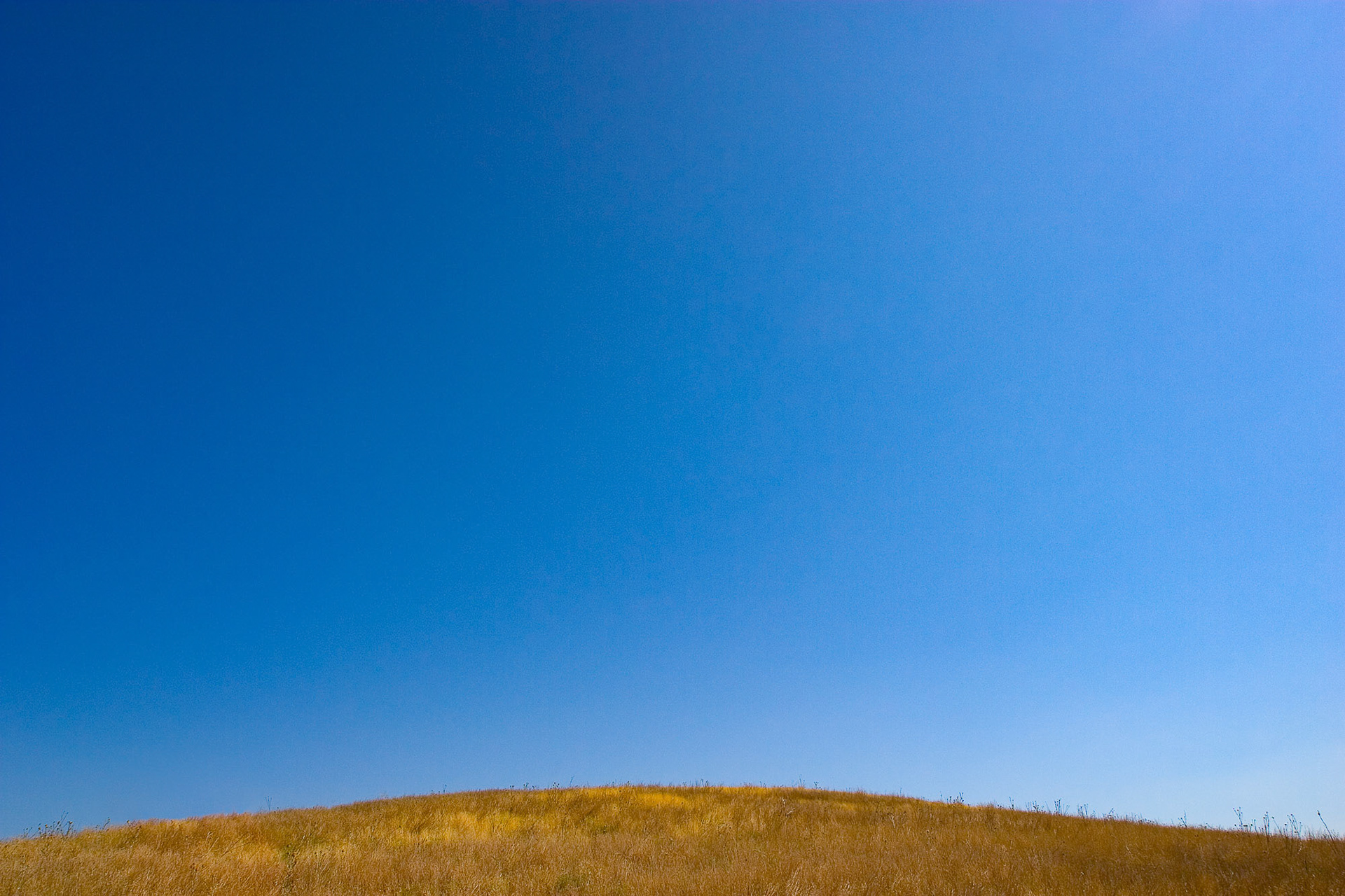 "Surmeli Mound" - A clear blue sky and the perfect flat curve of Surmeli Mound made this minimalistic image.