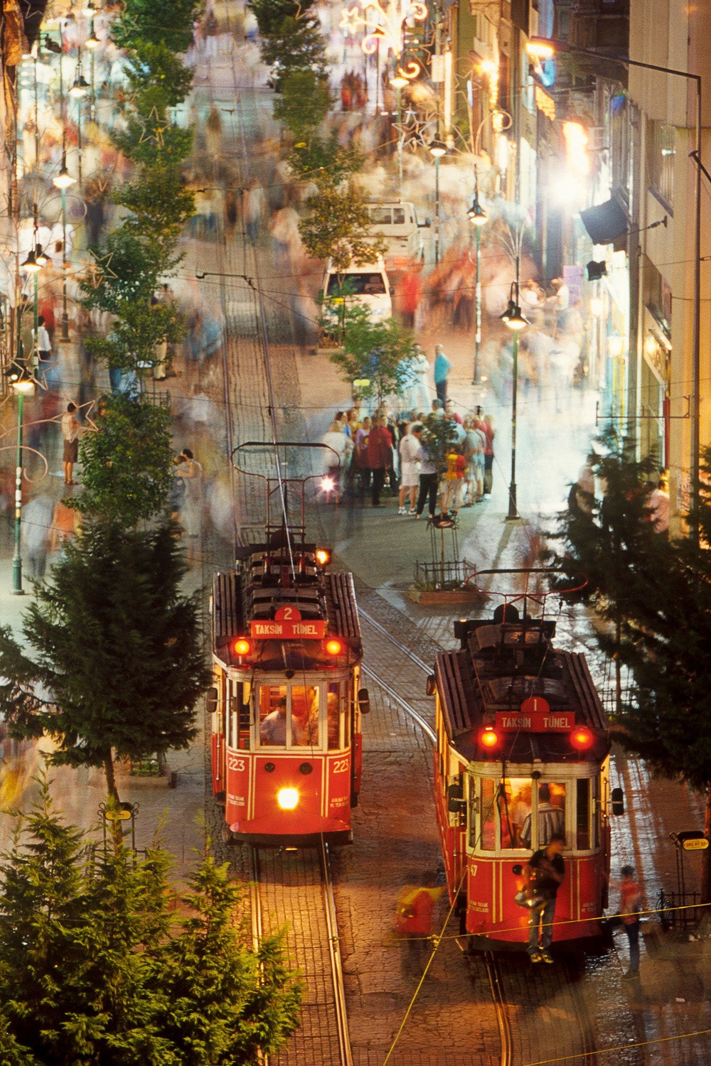 "Trams in Beyoglu" - I shot Trams in Beyoglu, a popular photograph, from the balcony of a cafe overlooking the part of the track where the two nostalgic trams come side by side. The cafe had a menu item for photographing from there! I ordered one coffee and one photography, and shot away...