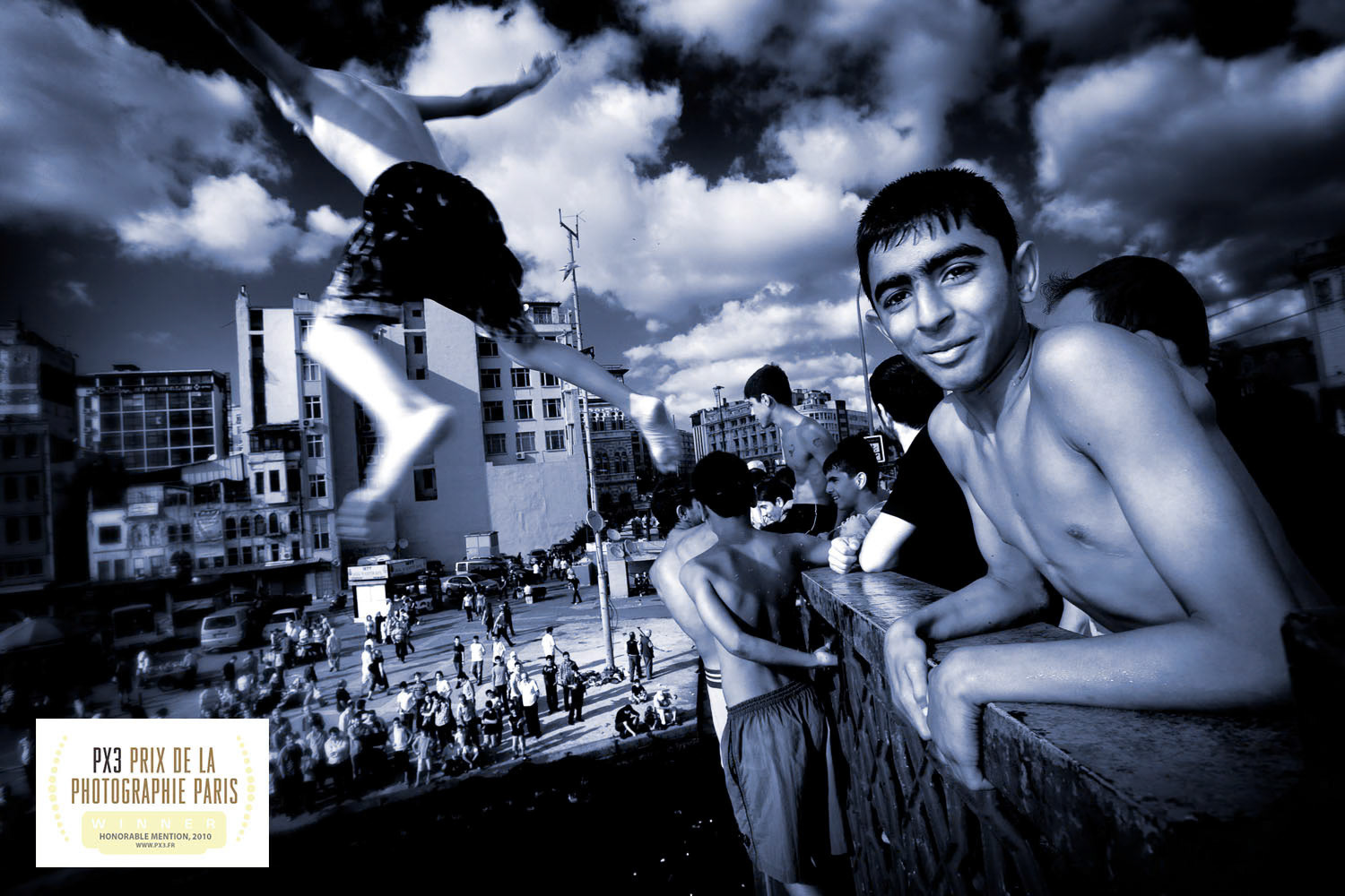 "Children on Galata Bridge" - I shot this award winning photograph on the Galata Bridge in Istanbul. I was out in search of great images for a book project about Istanbul. When I saw children jumping from the bridge into the waters of the Golden Horn I squeezed my way through the crowd, leaned over the railing and shot away. I love the surprise element of photography. One never truly knows what to expect.