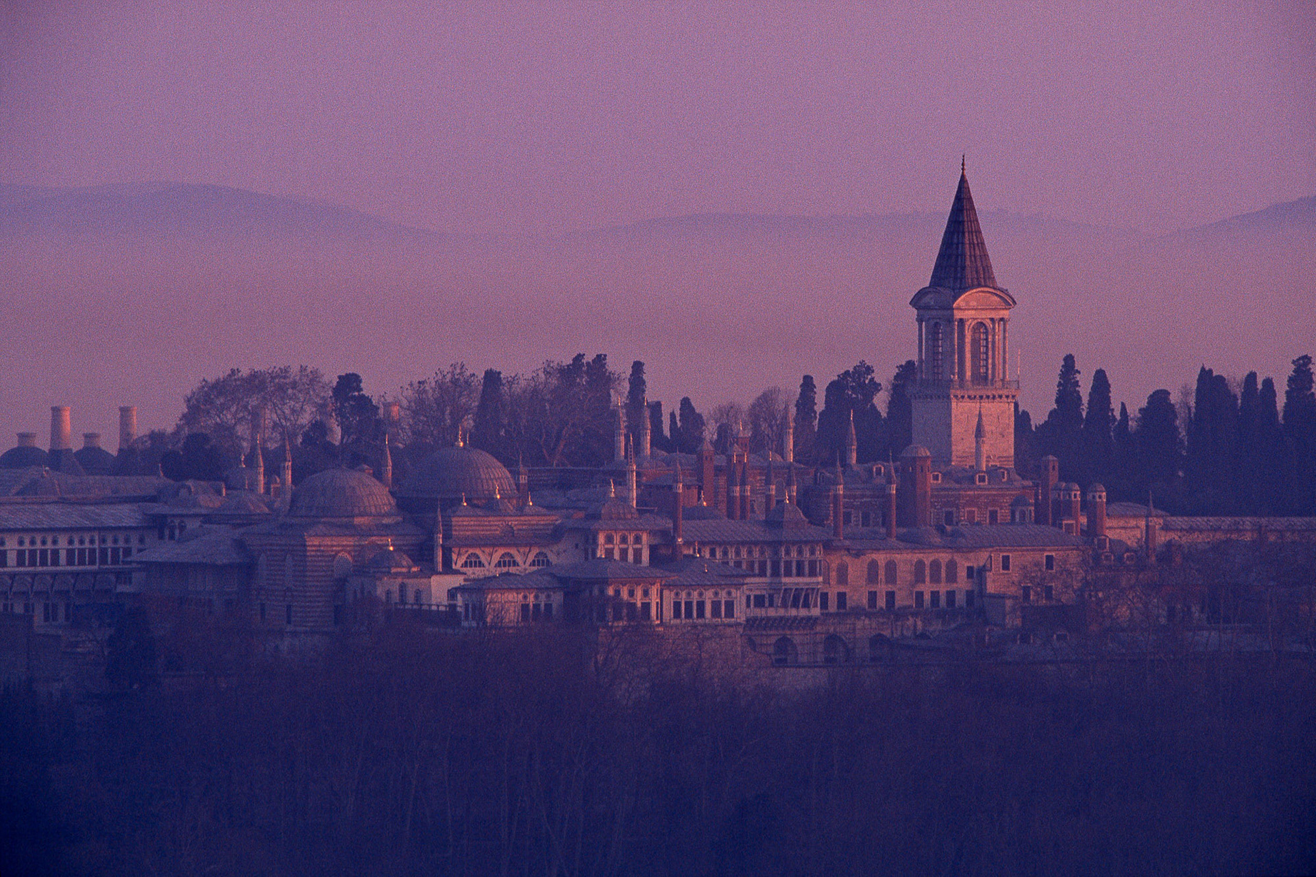 "Topkapi" - I was shooting the scenery around the Golden Horn from the top of the Galata Tower. As the sun started to set, this view of the Topkapi Palace appeared in the distance for which I took out my telephoto lens. The fog over the Marmara Sea and the peninsula in the background completed the dreamlike setting.
