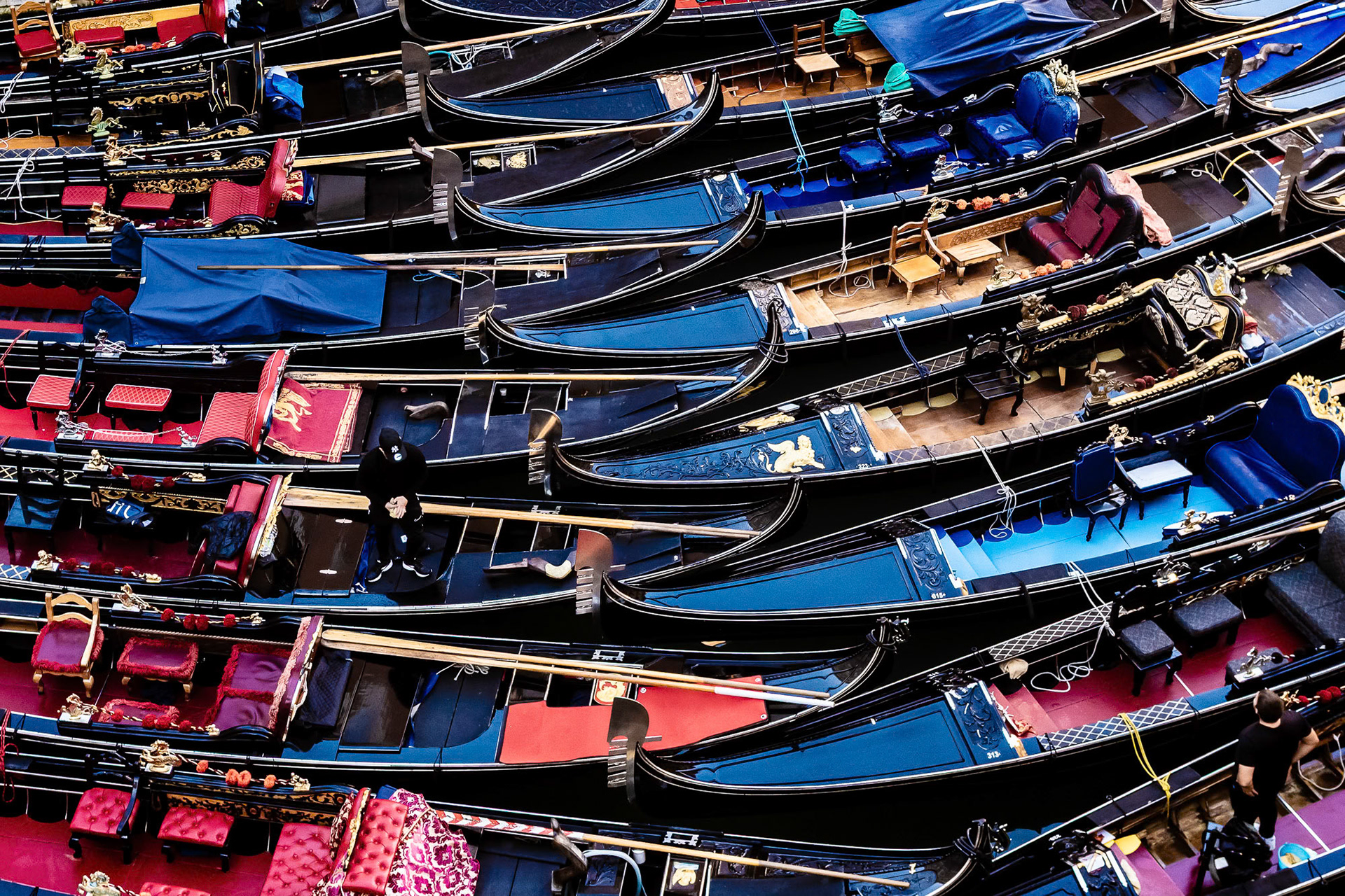 "Gondolas" - Venice's signature gondolas at their parking spot, being cleaned and prepared early in the morning for their daily activity.