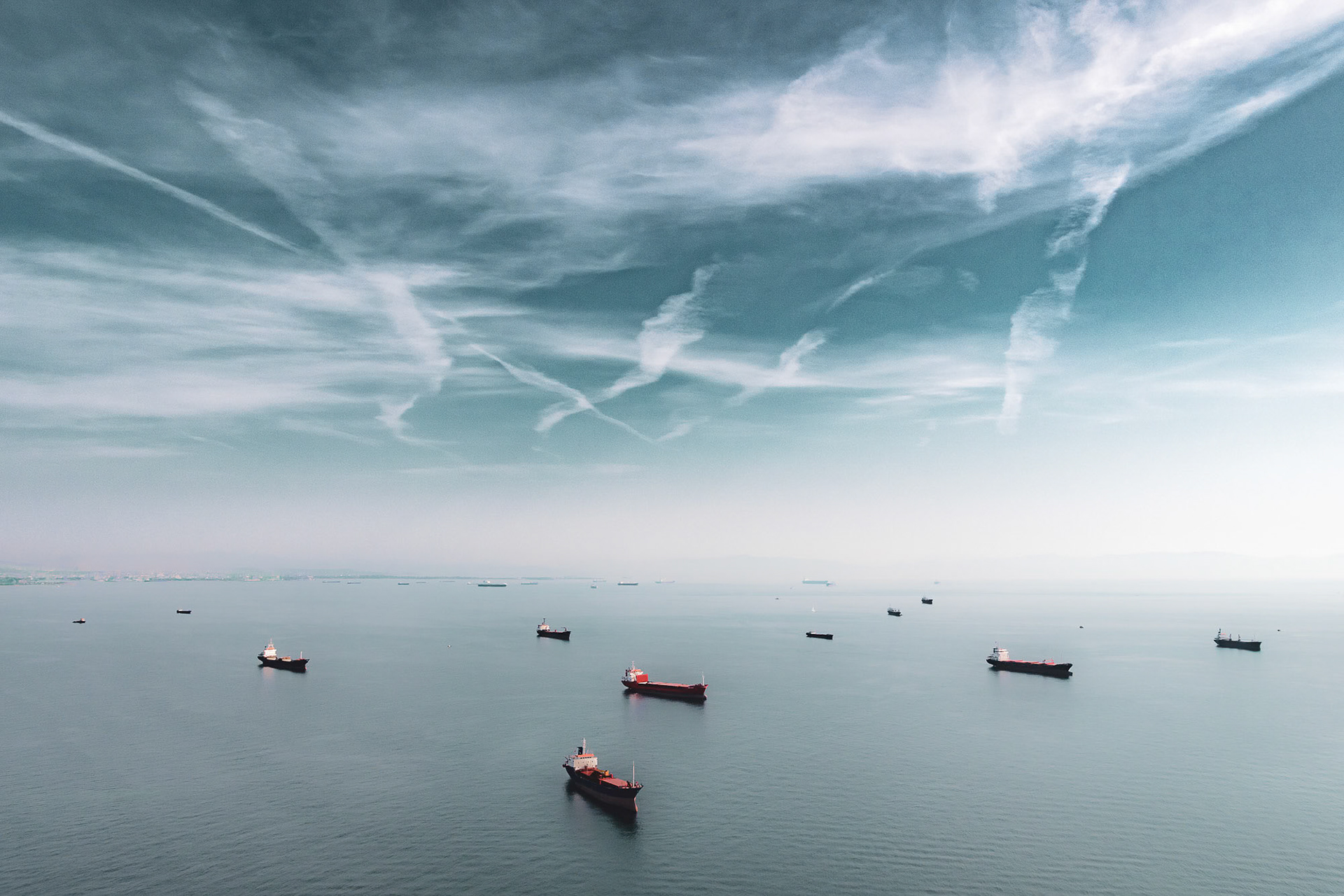 "In the Moment" - Being in constant motion in the air creates opportunities for interesting photographic moments. While flying in my paramotor along the Marmara Sea coast of Istanbul, once I realized the potential of the unusual clouds and the ships waiting in the calm sea, I positioned myself correctly and pressed the shutter button.