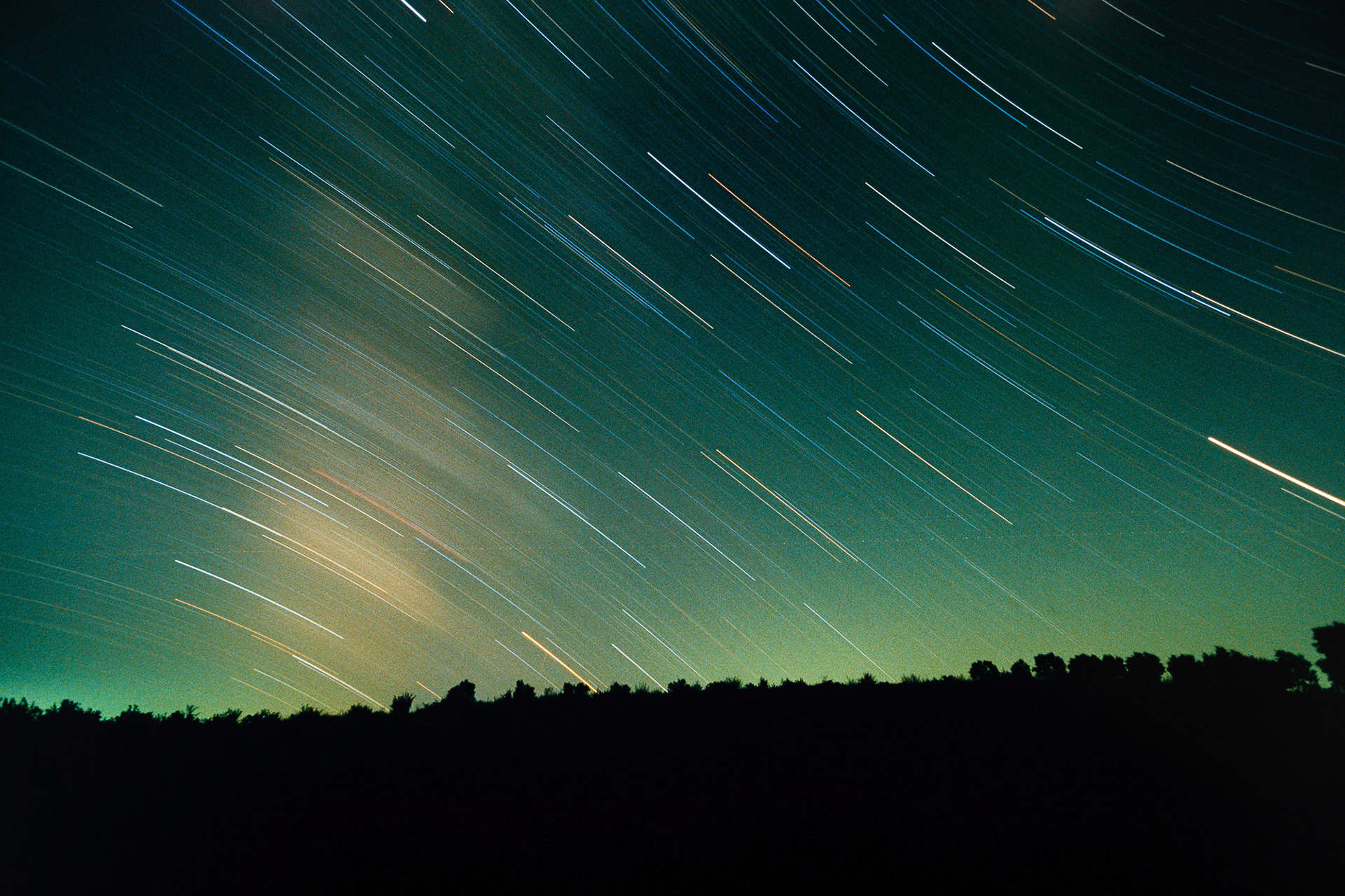 "Cakirca" - There was no typical mound left in Cakirca like many of the mounds that are flattened by people. So I decided to shoot the night sky together with the land where the mound was. It's my favorite star trail image. One can see the colors of the stars, shooting stars, airplane lights. The yellow cloudy patch on the left is the Milky Way.