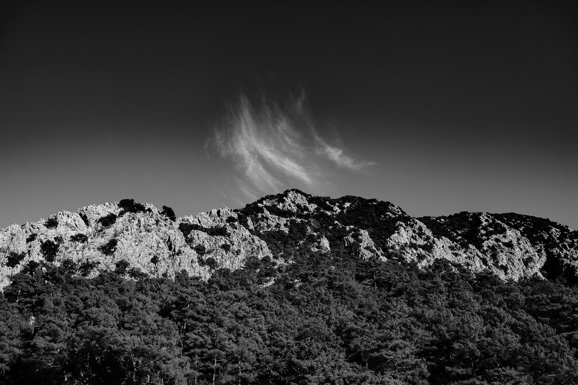 "Olympos Rising" - Spectacular rocky cliffs and pine forests of Olympos form a solid base for rising clouds.