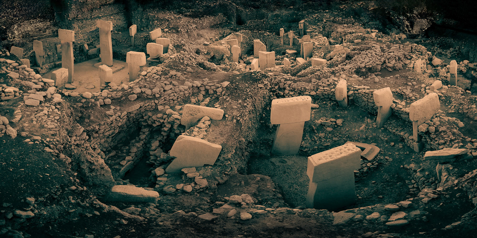 “Göbeklitepe” - My take on this important archaeological site. Göbeklitepe is a Neolithic archaeological site in Turkey. Inhabited from c. 9500 to 8000 BCE, it is also referred to as "ground zero of history" in some popular sources. It is famous for its large circular structures that contain massive stone pillars, the world's oldest known megaliths. Most of these pillars are decorated with sculptural reliefs of humans, animals and abstract symbols providing archaeologists rare insights into prehistoric iconography. The findings reveal that hunter-gatherer communities must have had a highly developed and versatile social structure, and that there was some kind of understanding and pursuit of art.