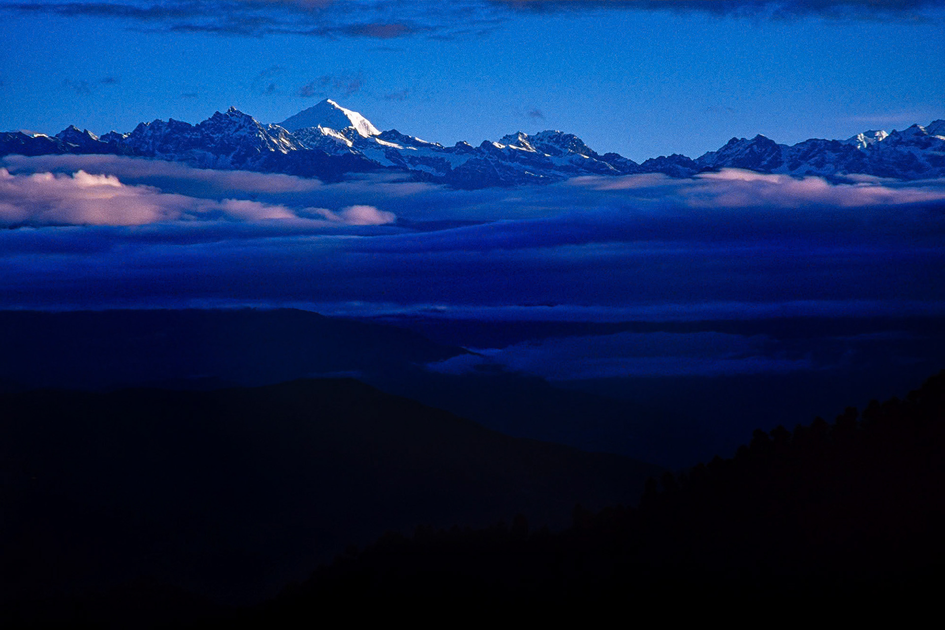"Himalayas" - Majestic mountain range of the Himalayas with its valleys, peaks and glowing Mount Everest at dawn.