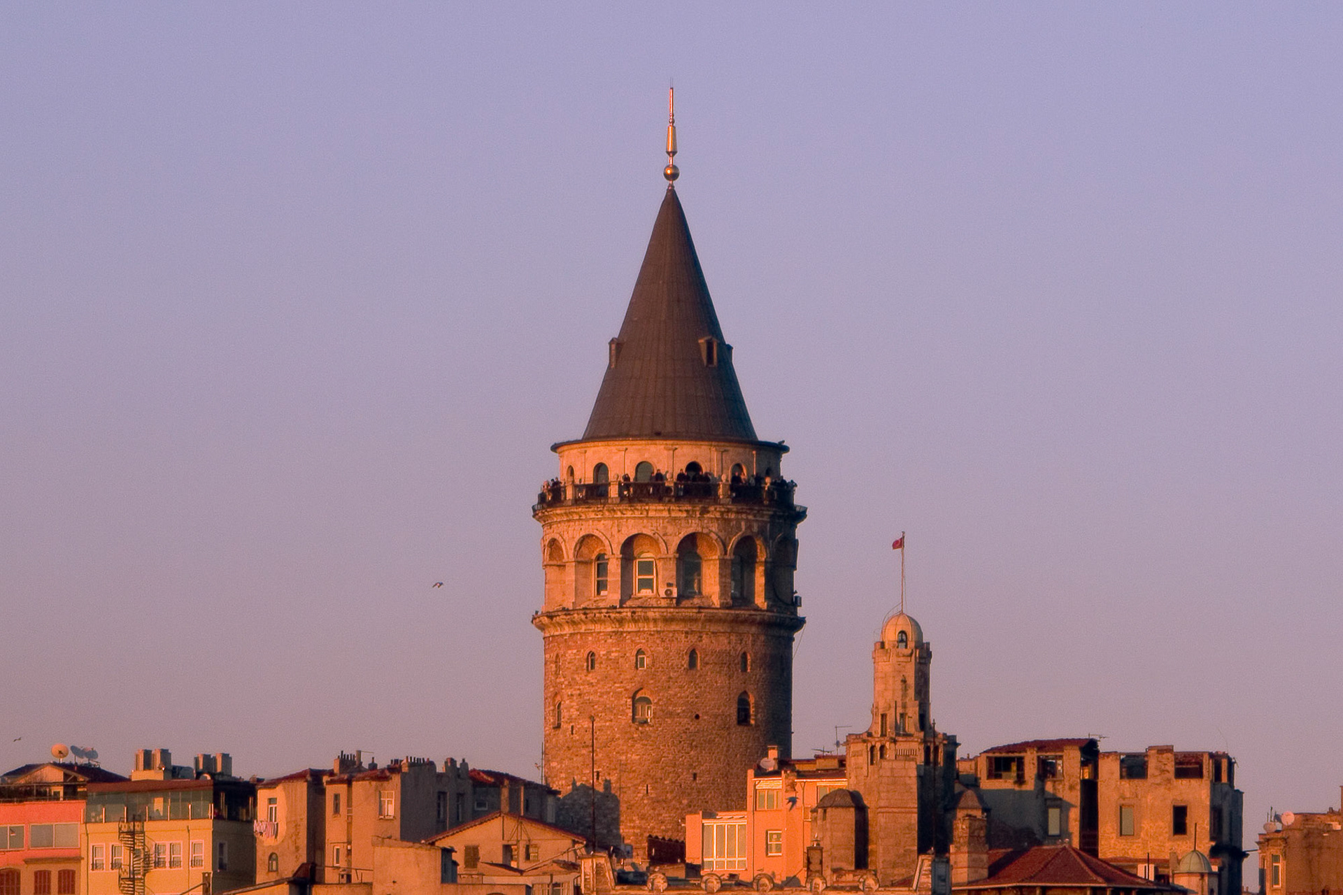 "Galata" - 62 meter (203 ft) high Galata Tower rises above the neighbouring modern buildings. It was built in 1348 by the Genoese as part of their fortifications. It was later used as a watchtower by the Ottomans.