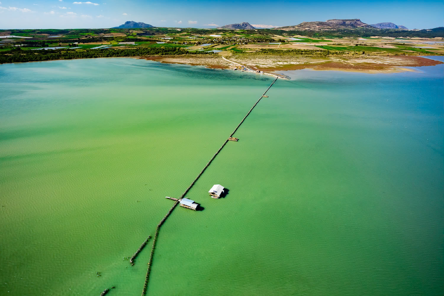 "Yumurtalik Fishery" - There is fishing in the natural fishery in the Sarıgöl area where fish such as sea bass, mullet and bream enter for nesting in the season. It’s a resting stop for migratory birds such as ducks, geese and flamingos. This area, used for fishing, suddenly appeared before me like a painting. The color gradient that started in the water continued in different shades on land. Very calm flight conditions which normally occur by the sea were not so in the Çukurova area. Air turbulence created by thermals caused by the lay of the land made flying difficult.