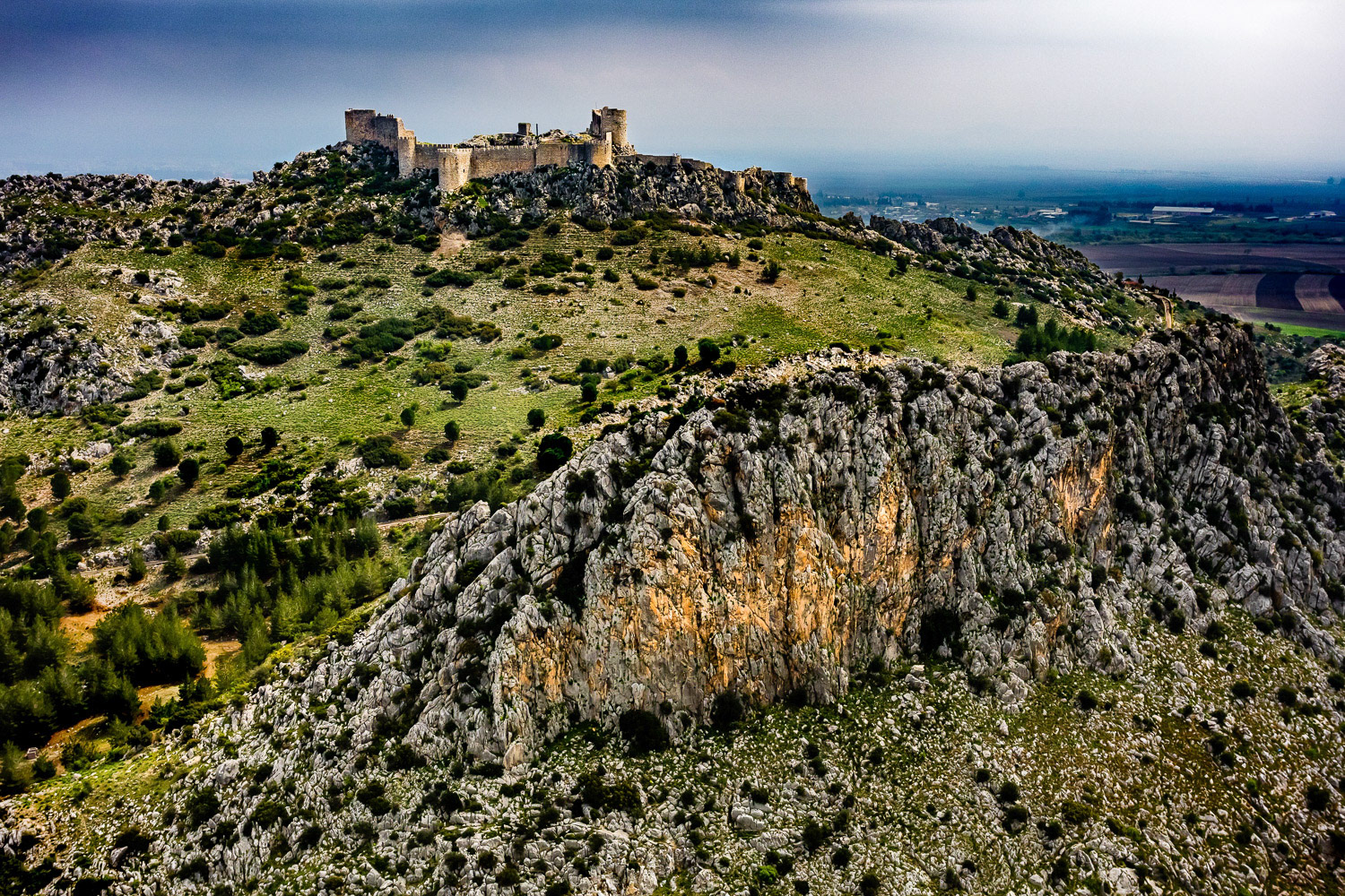 "Snake Castle" - Yilankale (Snake Castle) is located 10 km west of the town of Ceyhan. During the Crusades in the 12th Century, it was built on a dominant hill near the Ceyhan river. It's one of the most important of the nearly 50 castles in Adana. When I came to photograph it, we found a very narrow path suitable for takeoff between cultivated areas. After the takeoff, this stunning white castle built on stark rocks and twisting like a serpent, seemed like an unreal figure out of fantastic films.