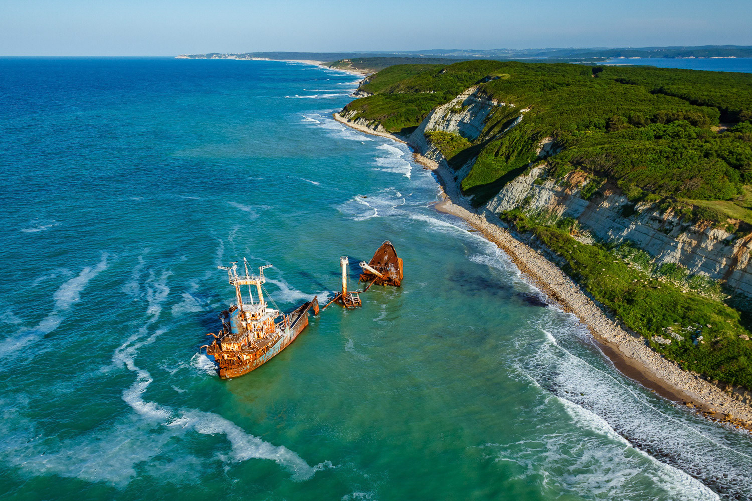 "Shipwreck" - Virgin Black Sea coastline in soft late afternoon light make a fine backdrop for the blue and rust colored shipwreck. I flew over the ship many times over the years before it was finally broken apart and salvaged. It was one of my favorite spots along the coastline to the west of Istanbul.