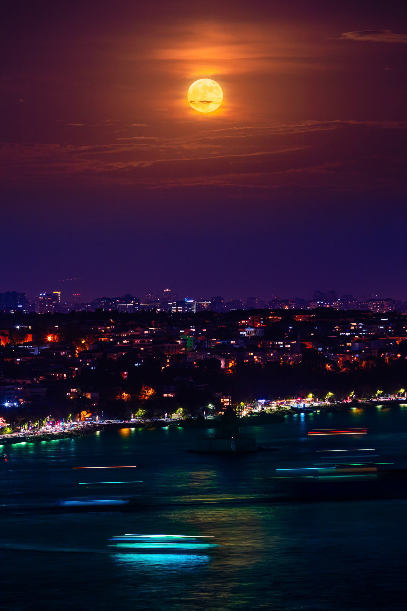 "Super Full Moon" - My take of the Super Full Moon with a modern touch, as it illuminates the Bosphorus where boats cruise with their colorful streaks of lights.