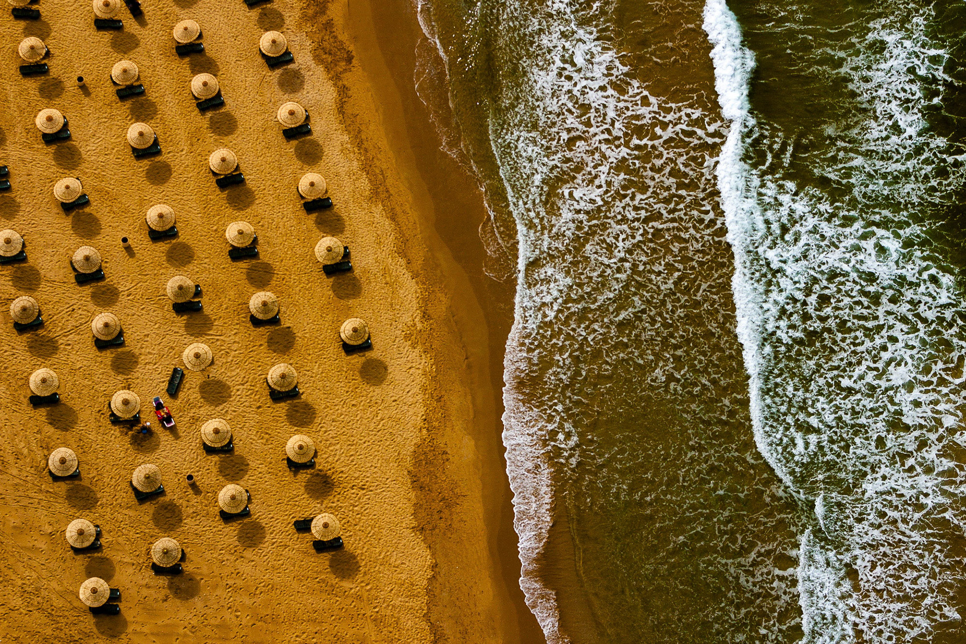 "Burc Beach" - If there is a coastline, we paramotor pilots love flying alongside it as the wind coming from the water is so smooth that one can fly all day long without encountering turbulent air. On such a day I captured this image of an off-season Black Sea beach having many compositional elements such as lines, texture, symmetry and pattern making it one of my most successful photographs. It was featured in National Geographic and Canon Europe Editor's Choice.