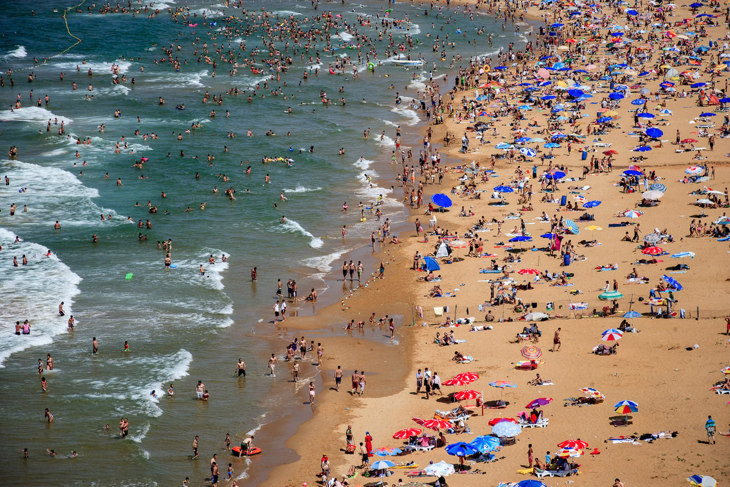 "Black Sea" - I was flying along the Black Sea coast on a hot summer Sunday towards the popular Gumusdere Beach and was shocked to see so many people. They became the texture in this photograph.