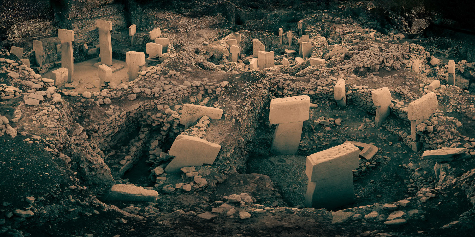 “Göbeklitepe” - My take on this important archaeological site. Göbeklitepe is a Neolithic archaeological site in Turkey. Inhabited from c. 9500 to 8000 BCE, it is also referred to as "ground zero of history" in some popular sources. It is famous for its large circular structures that contain massive stone pillars, the world's oldest known megaliths. Most of these pillars are decorated with sculptural reliefs of humans, animals and abstract symbols providing archaeologists rare insights into prehistoric iconography. The findings reveal that hunter-gatherer communities must have had a highly developed and versatile social structure, and that there was some kind of understanding and pursuit of art.