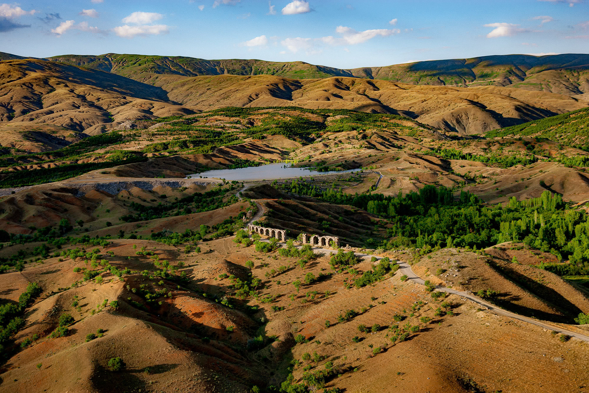 "Pisidian Antioch" - The lonesome aqueduct in the sunbathed terrain stood the test of time at Antioch in Pisidia, a city dating back to the 3rd century BCE in Yalvaç, Turkey. The city was at the crossroads of the Mediterranean, Aegean and Central Anatolian regions, and formerly on the border of Pisidia and Phrygia.