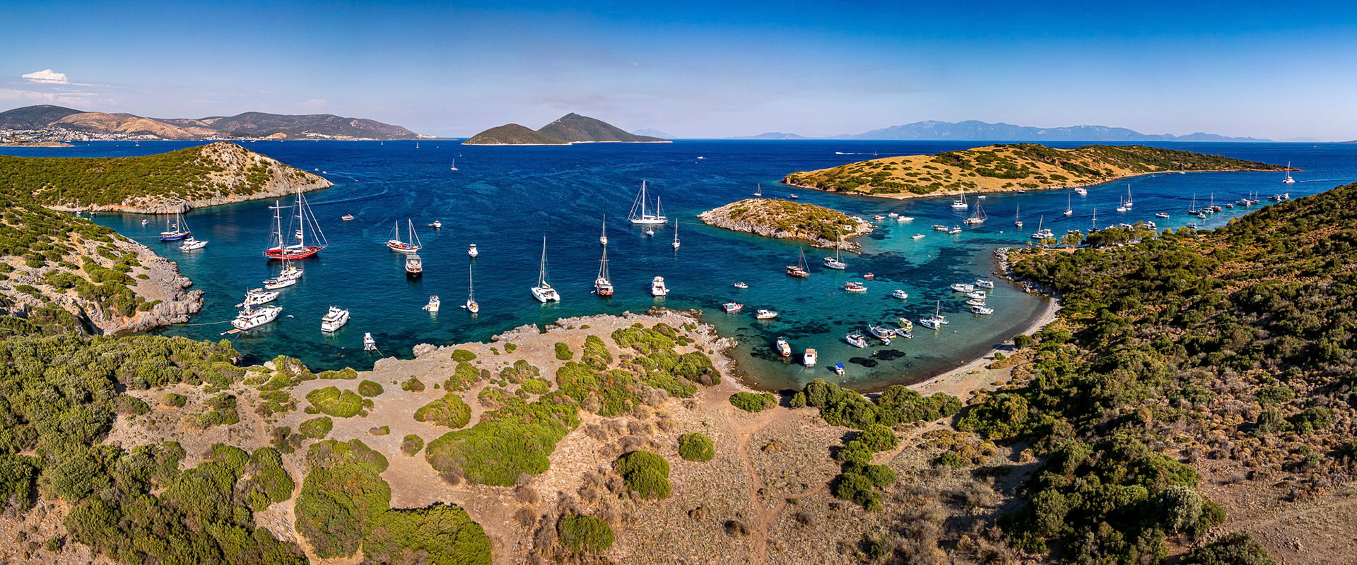"Paradise Cove Panorama" -  Aerial panorama view of a popular sailing stop with crystal clear Aegean waters in Bodrum.