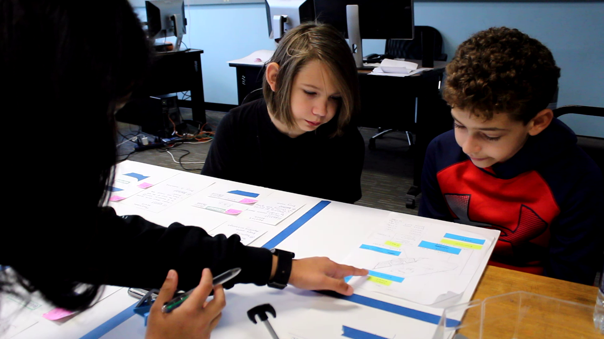 Paper-prototyping with children in early production phases.