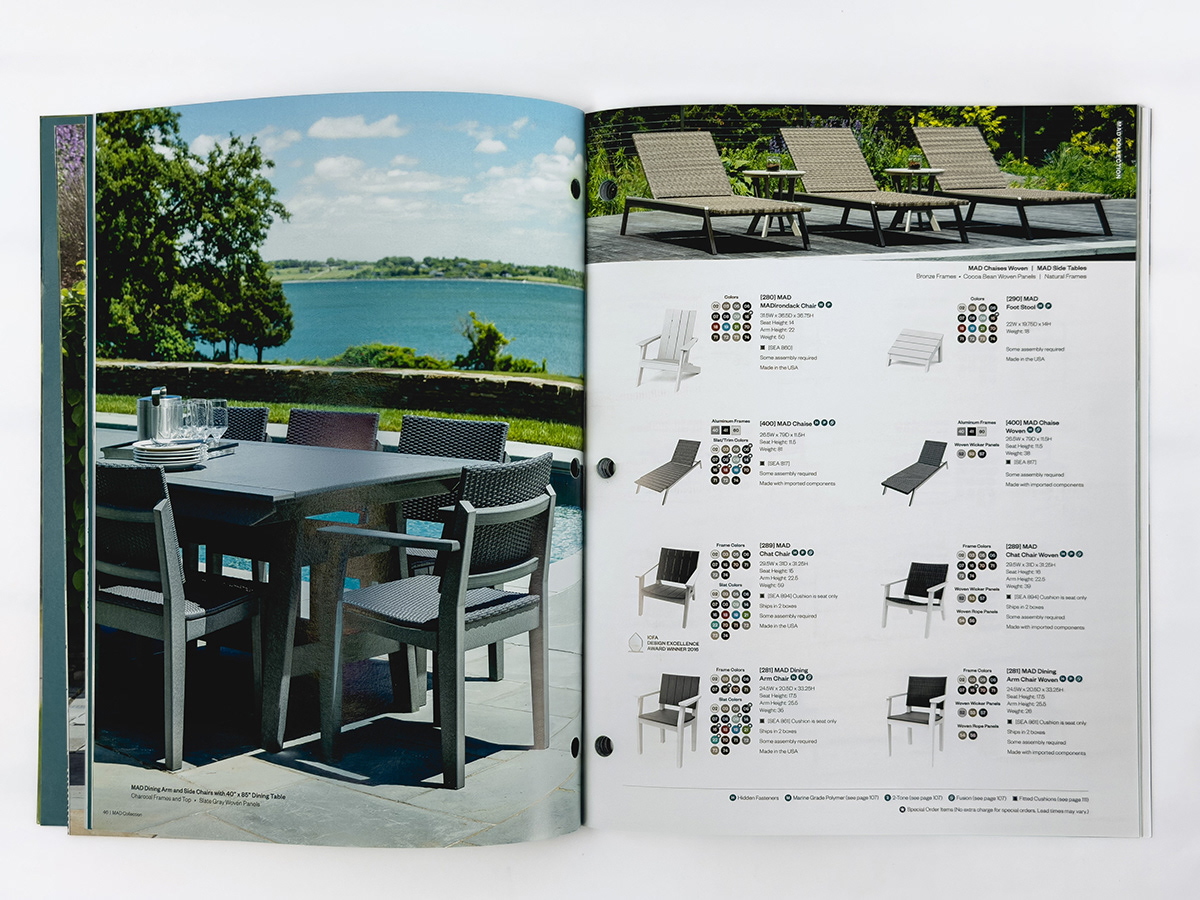 Outdoor chaise lounge chairs arranged on deck with greenery backdrop.