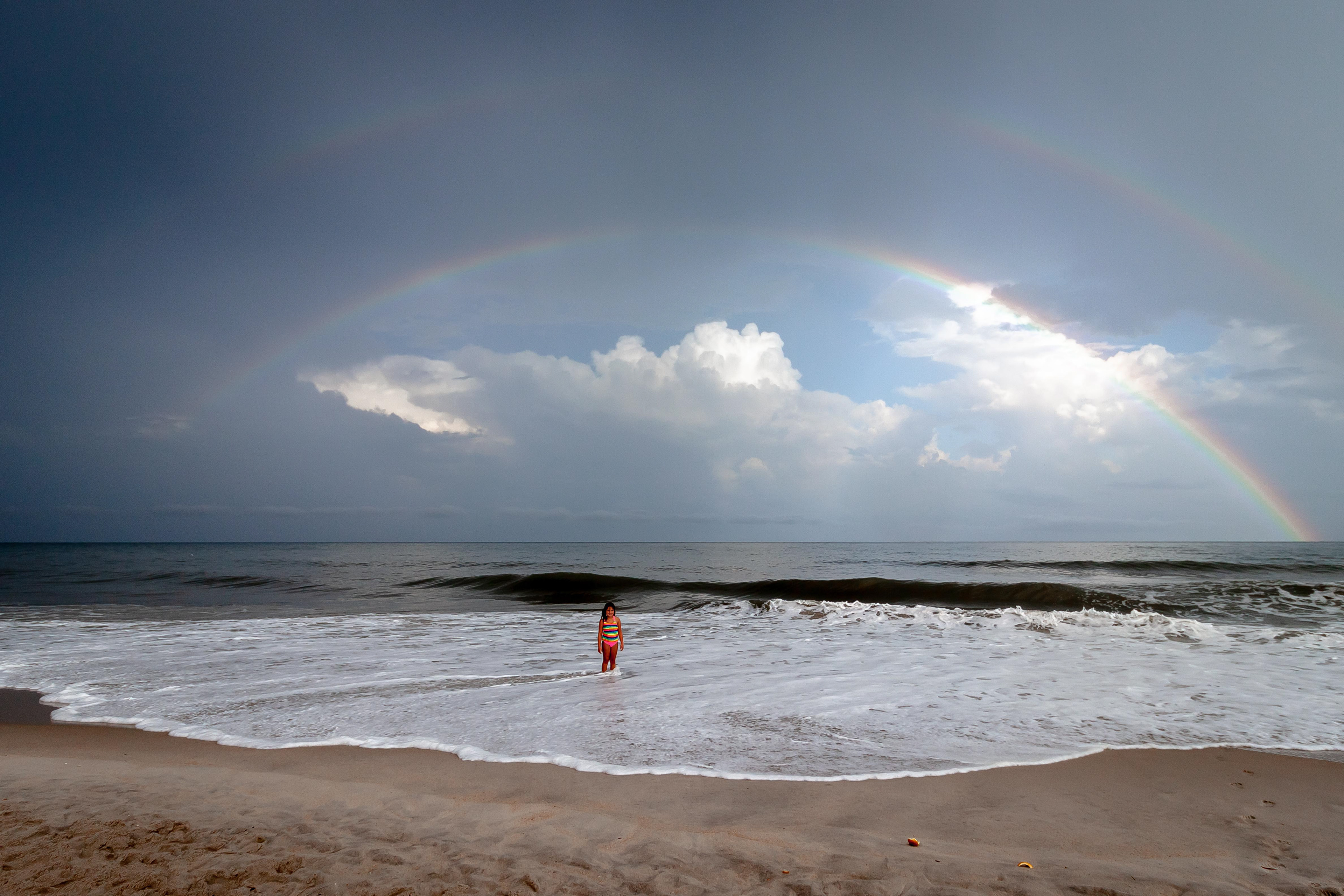 My daughter, Caity under double rainbow.