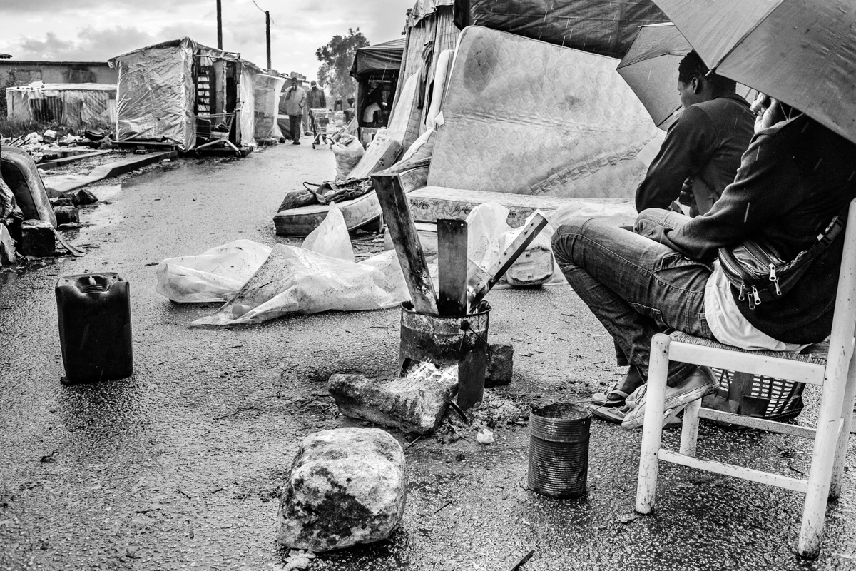 Homeless farm workers in the informal camp located at the Campobello di Mazara.