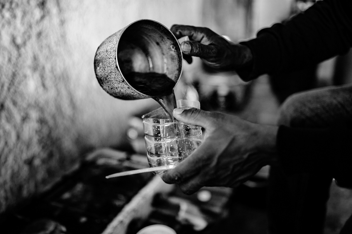 Cafe preparation in one of the abandoned houses around Campobella di Mazara. It's shelter for several people from Gambia and Senegal, there is no water and electricity, no toilet and bathroom or even doors or windows.