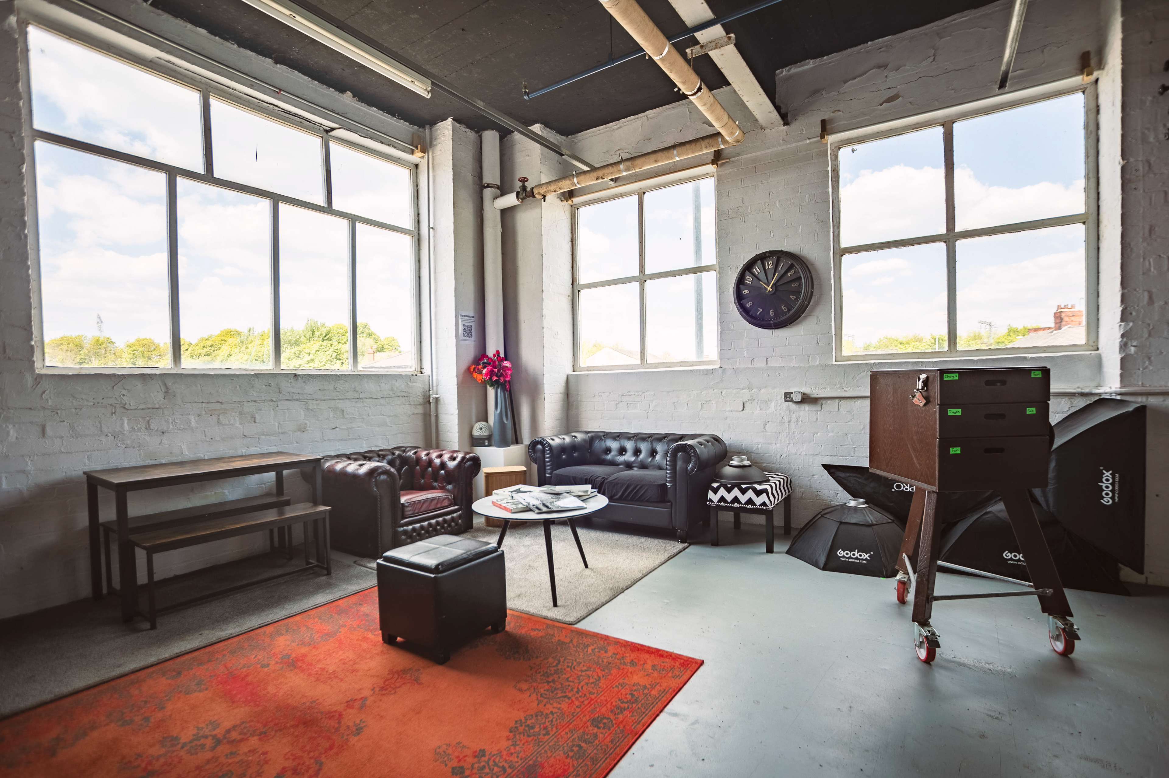 View of a chill out area within a photography studio showing furniture options