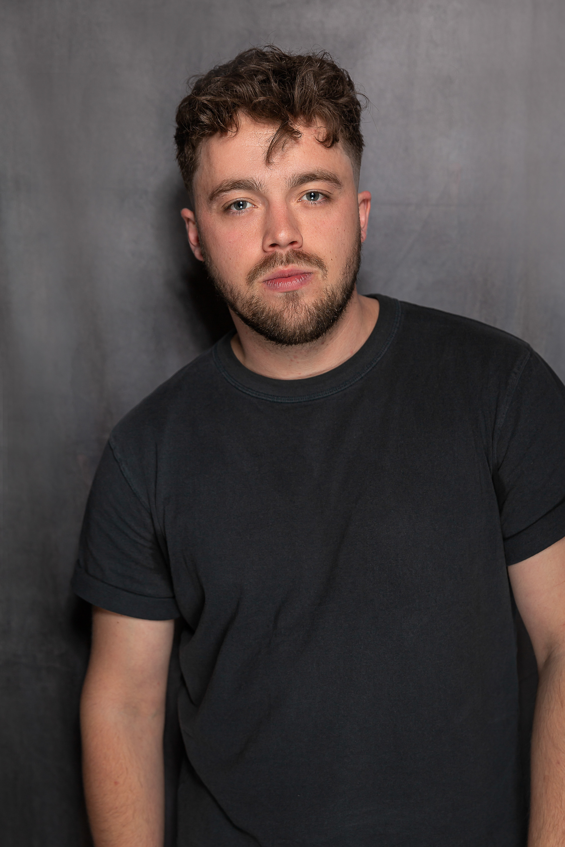 Portrait of a man on a faded grey background 