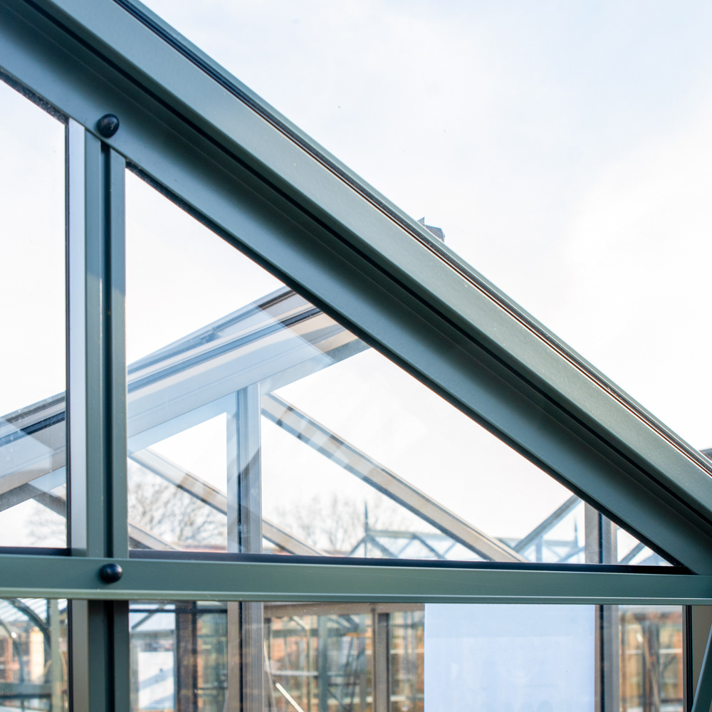 Replacement window panel in a greenhouse frame