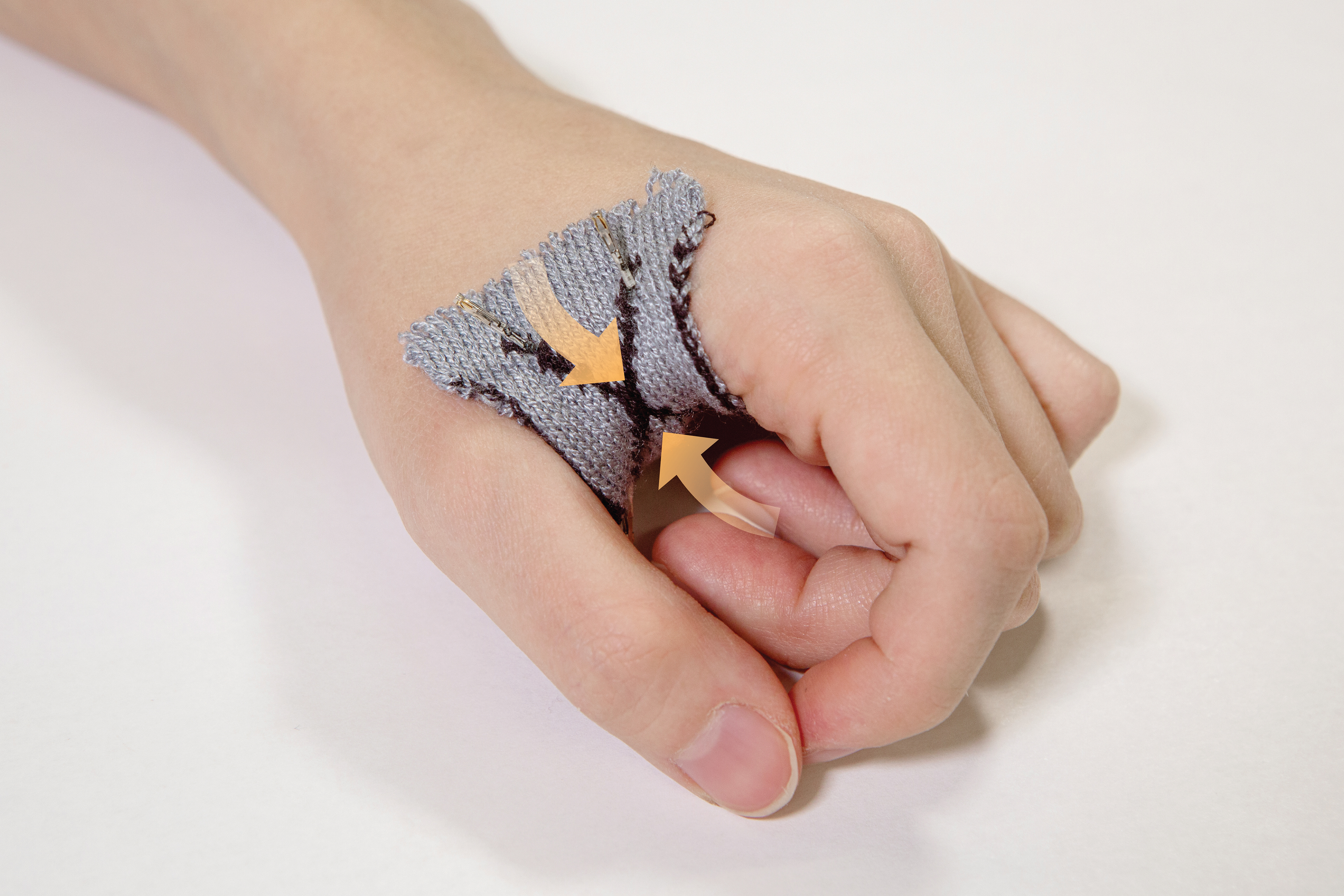 KnitDermis pinch interface during actuation while worn on the hand.