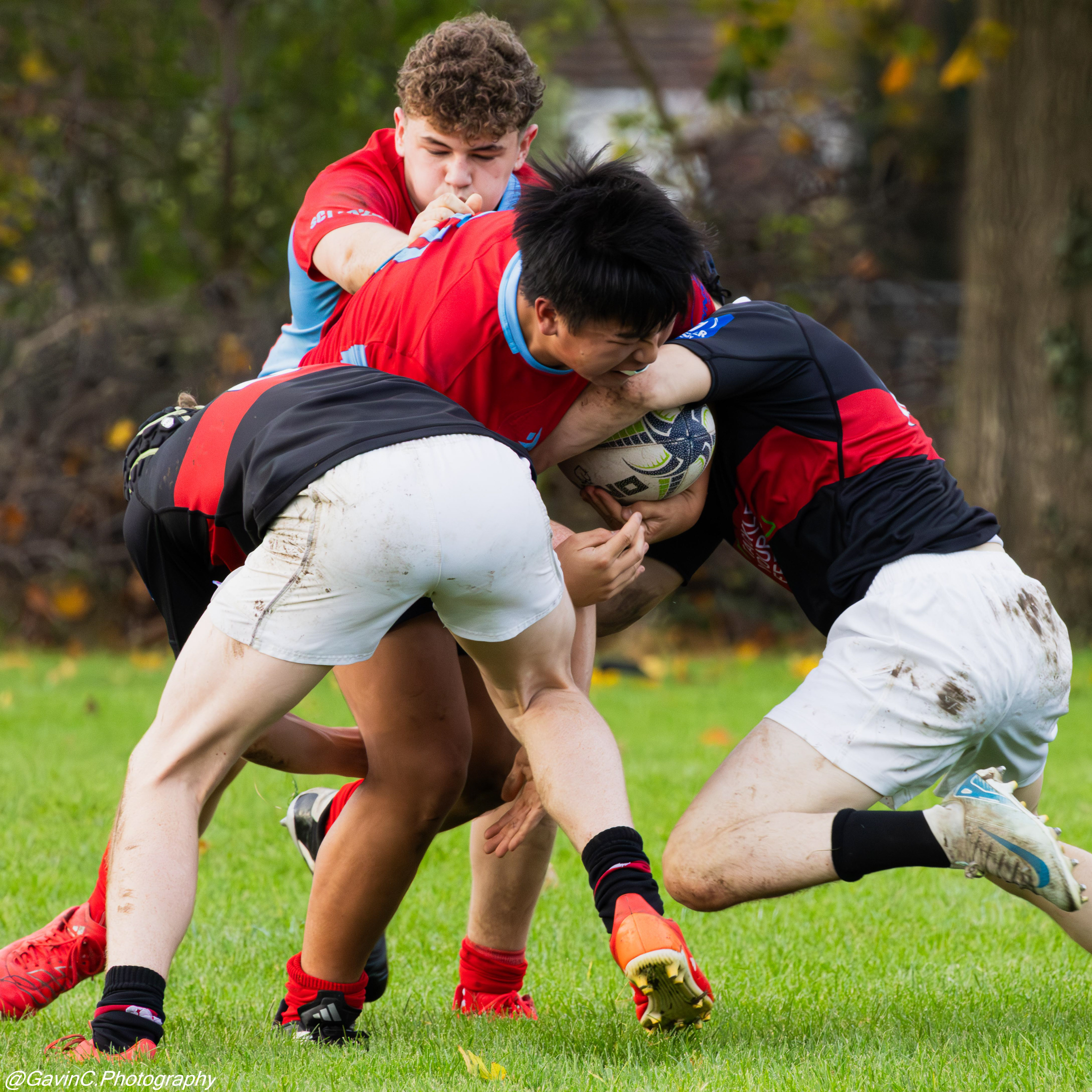 CUS player being tackled