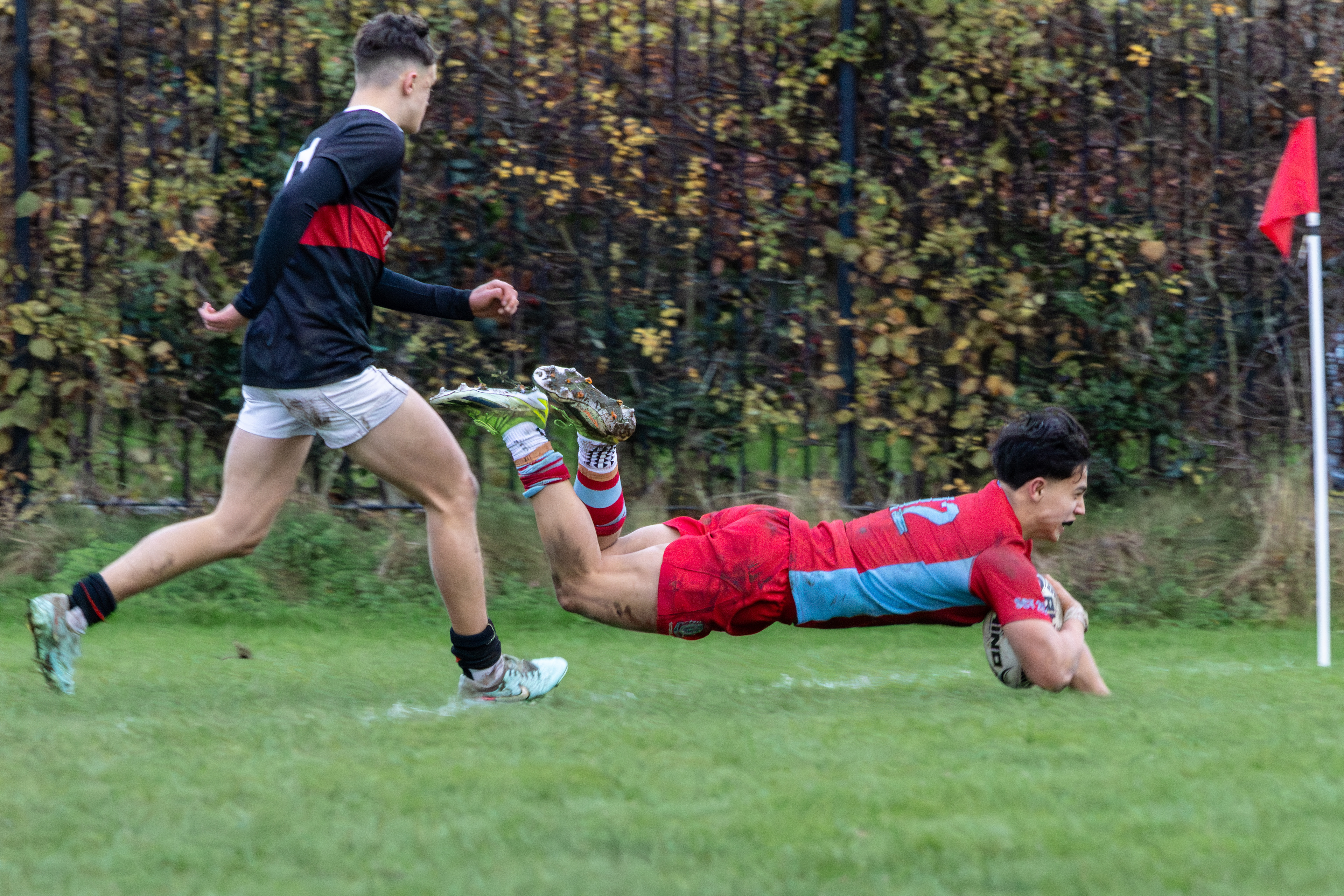 Cus Player scoring a try against The King's Hospital